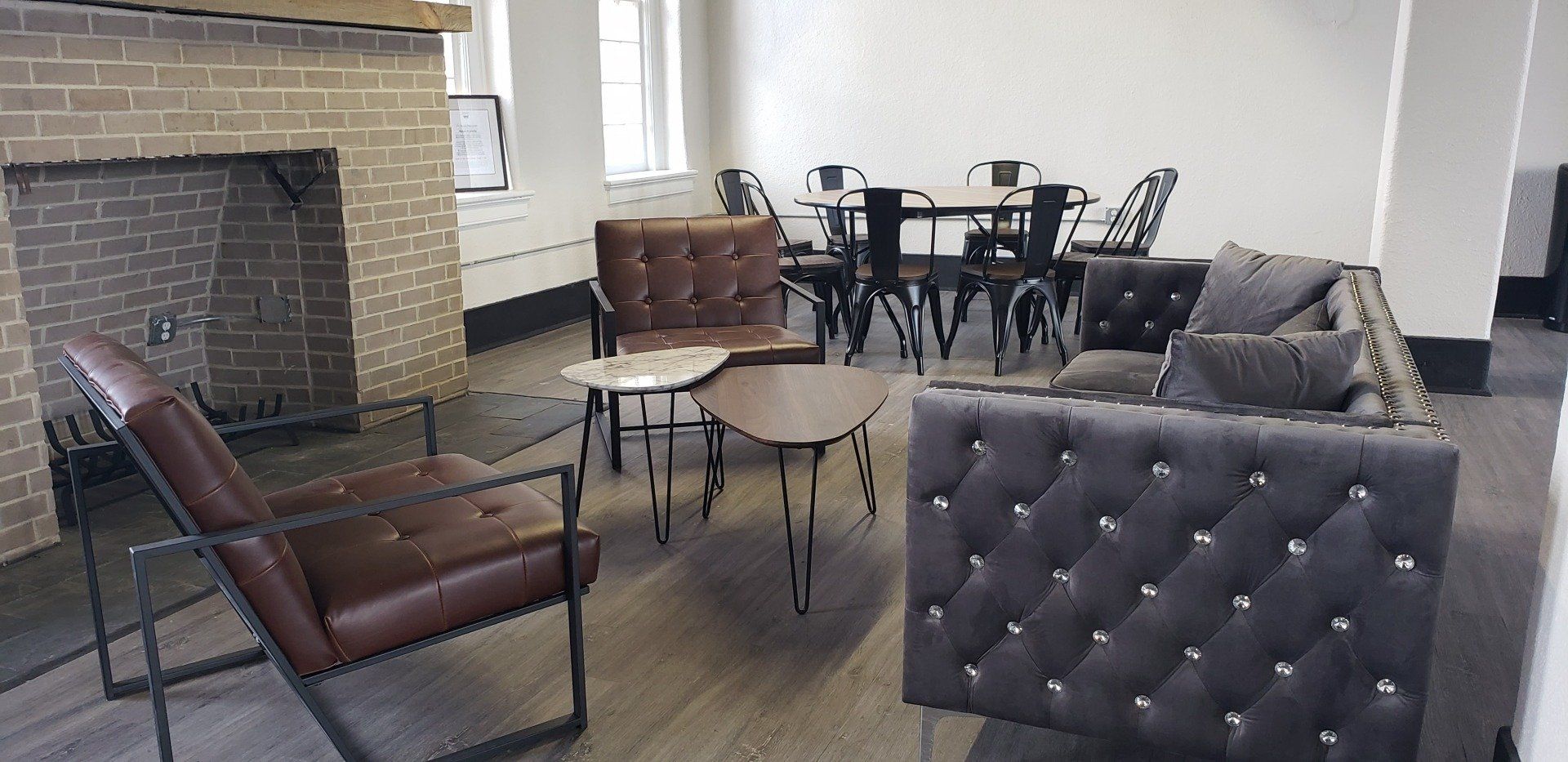 A living room filled with furniture and a fireplace.