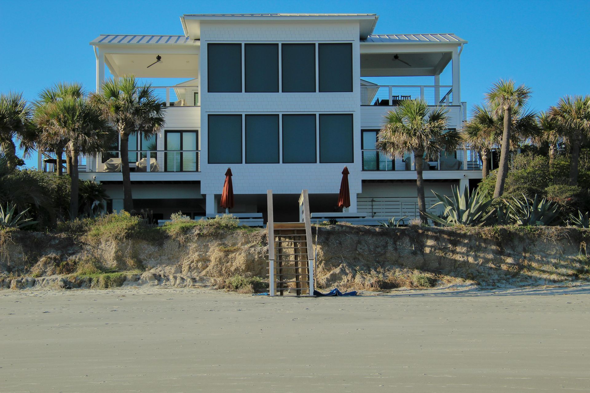 A tesla model 3 is parked in front of a building