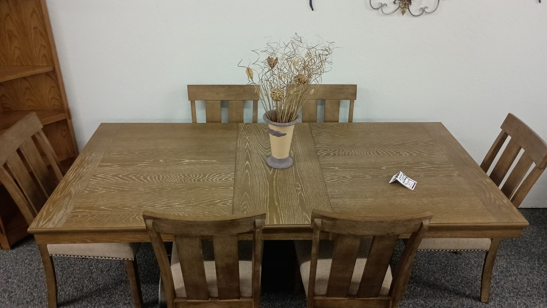 Wooden dining table set with six chairs.