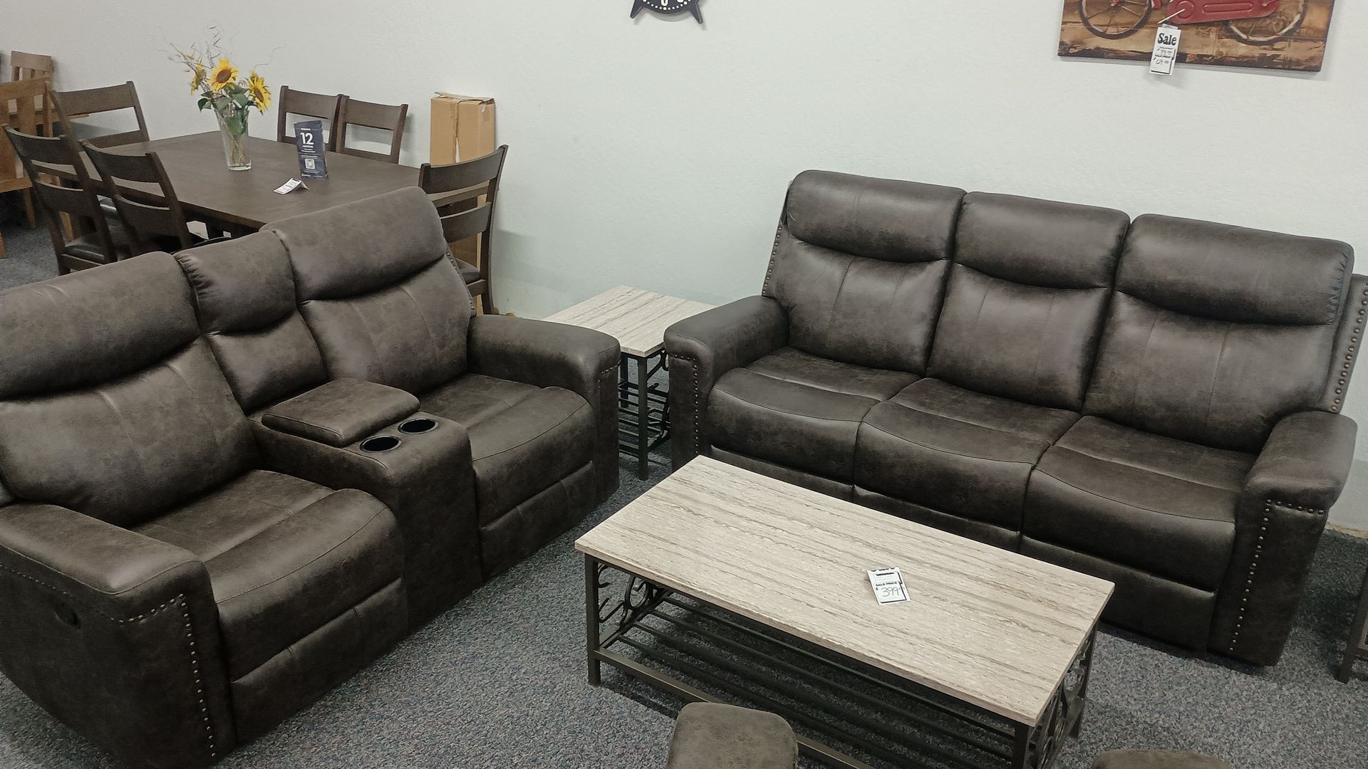 A living room set with a brown reclining loveseat, sofa, coffee table, and side table.
