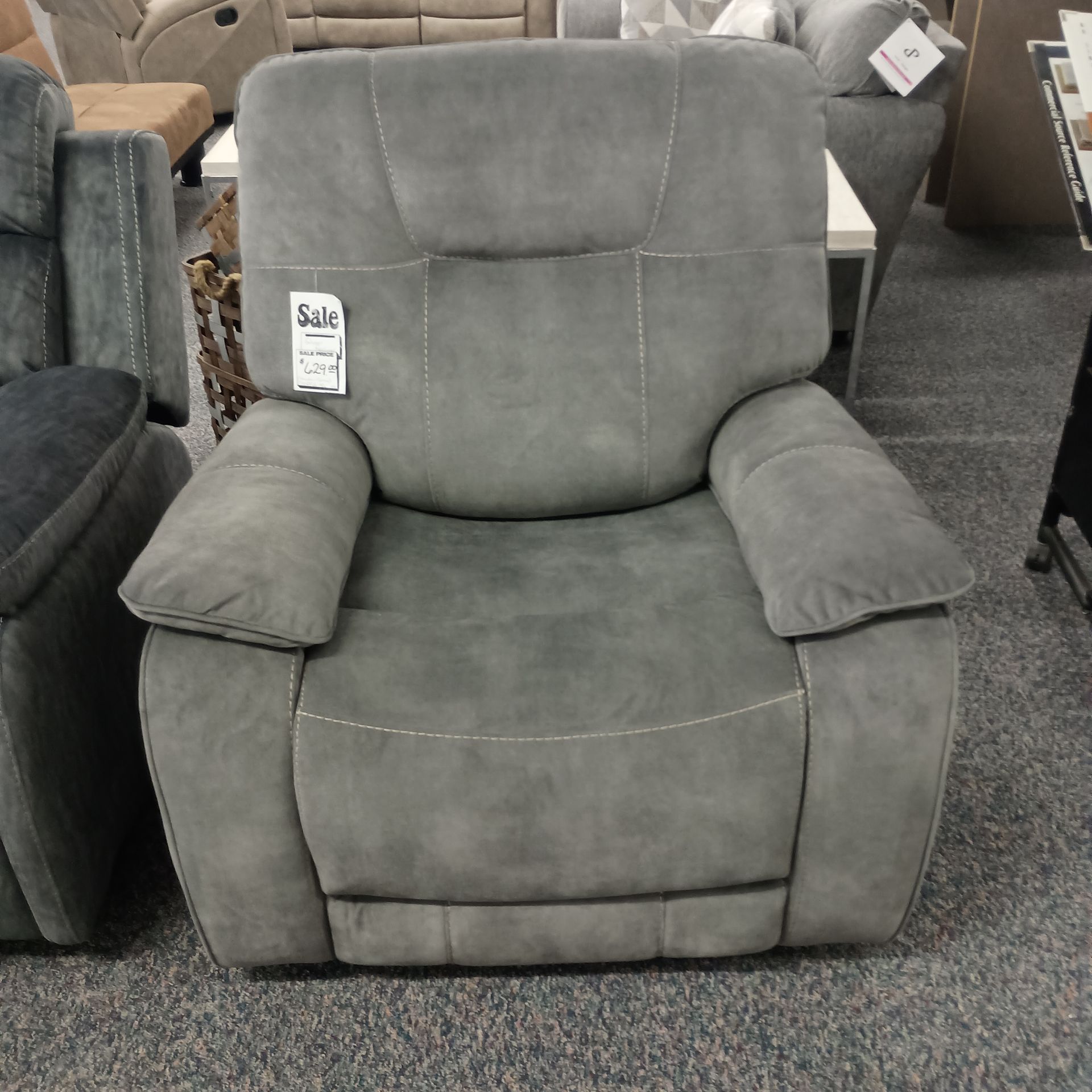 Gray recliner chair with light stitching