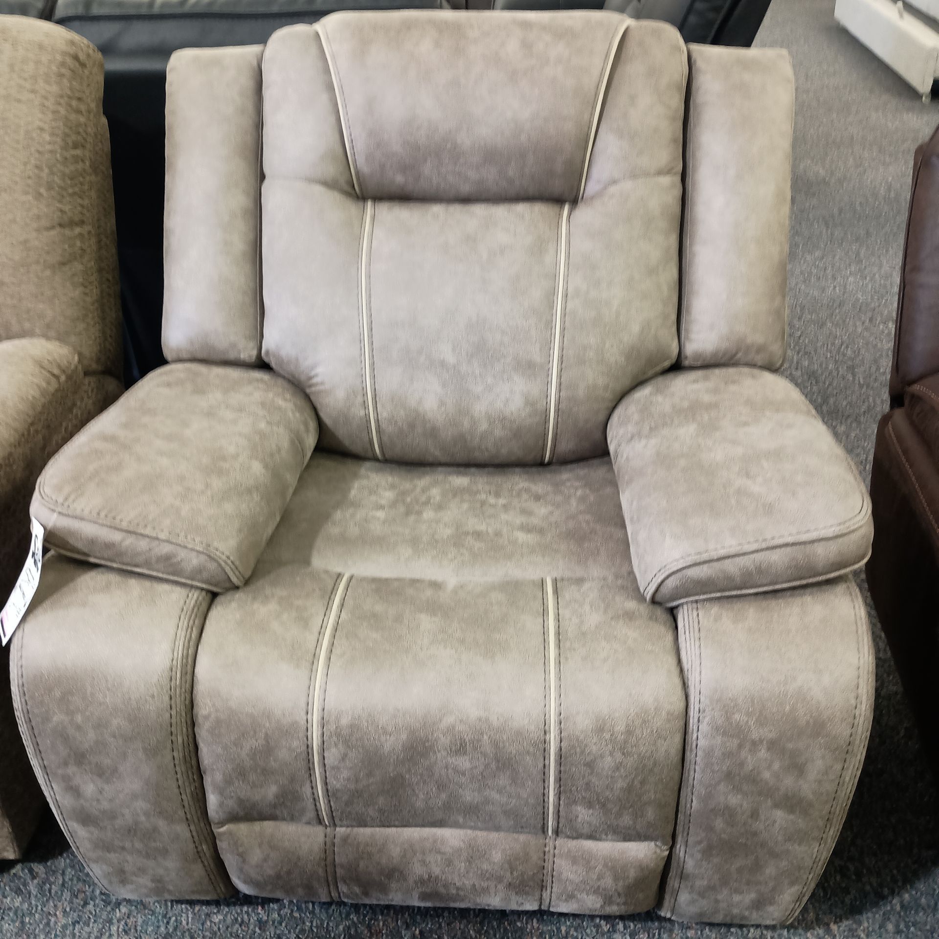 Tan upholstered recliner chair
