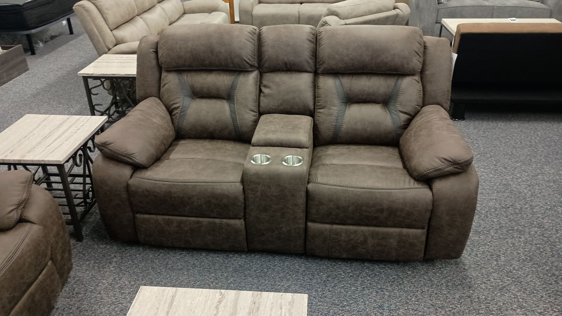 Brown reclining loveseat with a center console