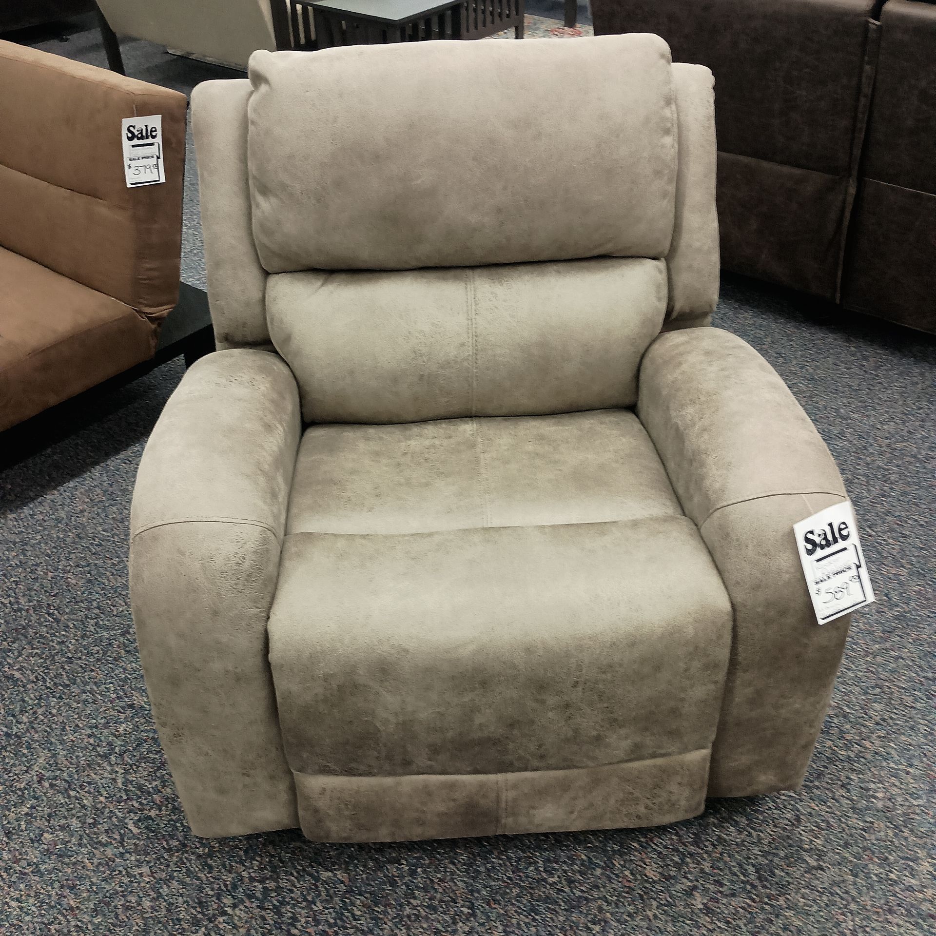 Tan recliner chair in a showroom