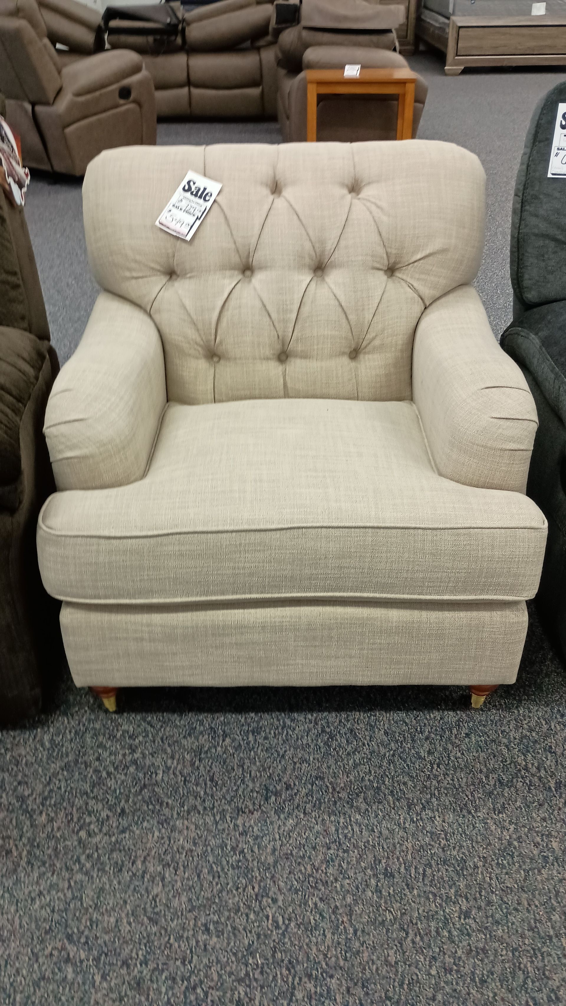 A chair in a store with a price tag on it