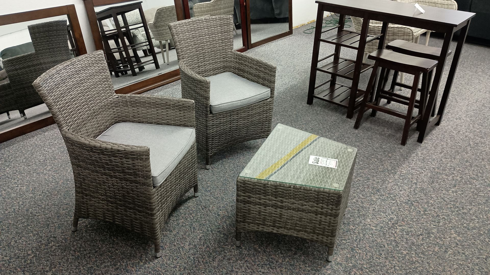 Two chairs and a table with the word art on it