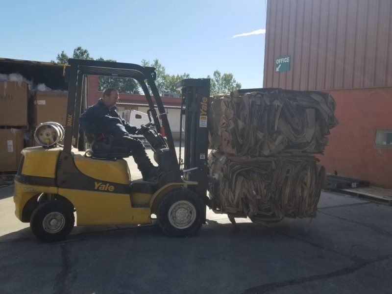 forklift lifting recycling paper
