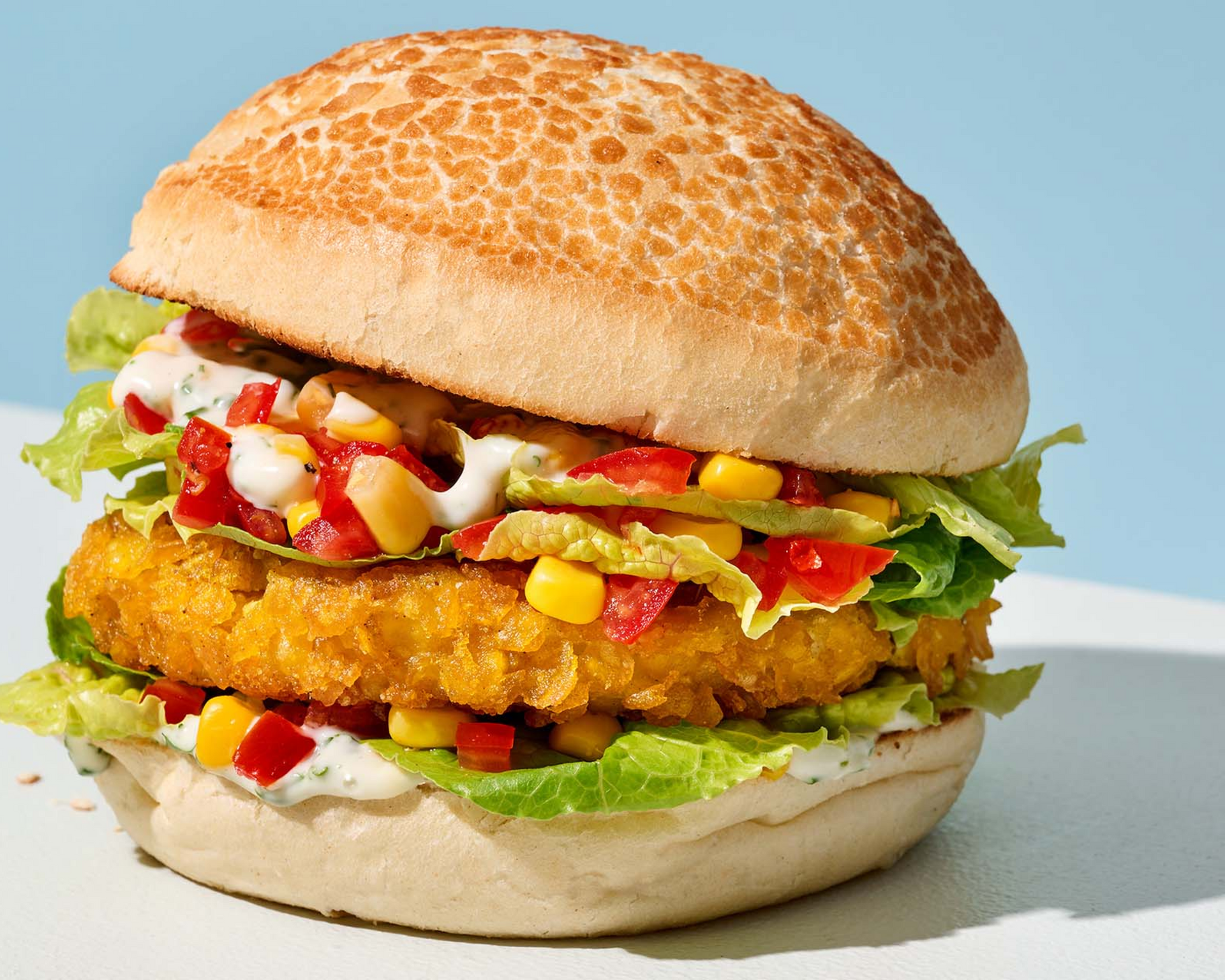 Crispy Chicken Burger Choice — poulet croustillant, tiger bun, livraison famille Uccle Uber Eats