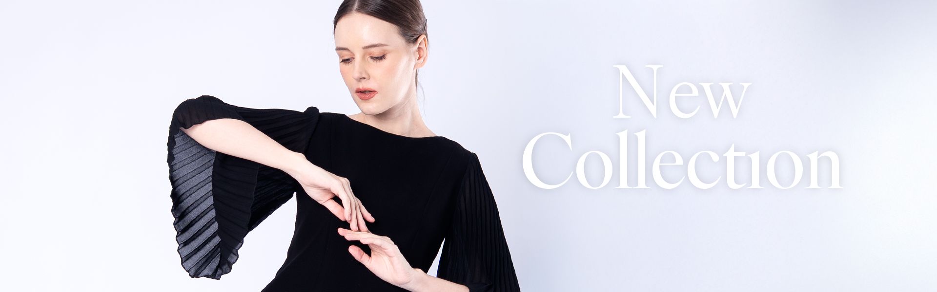 Woman in black dress, hands gesturing, text 