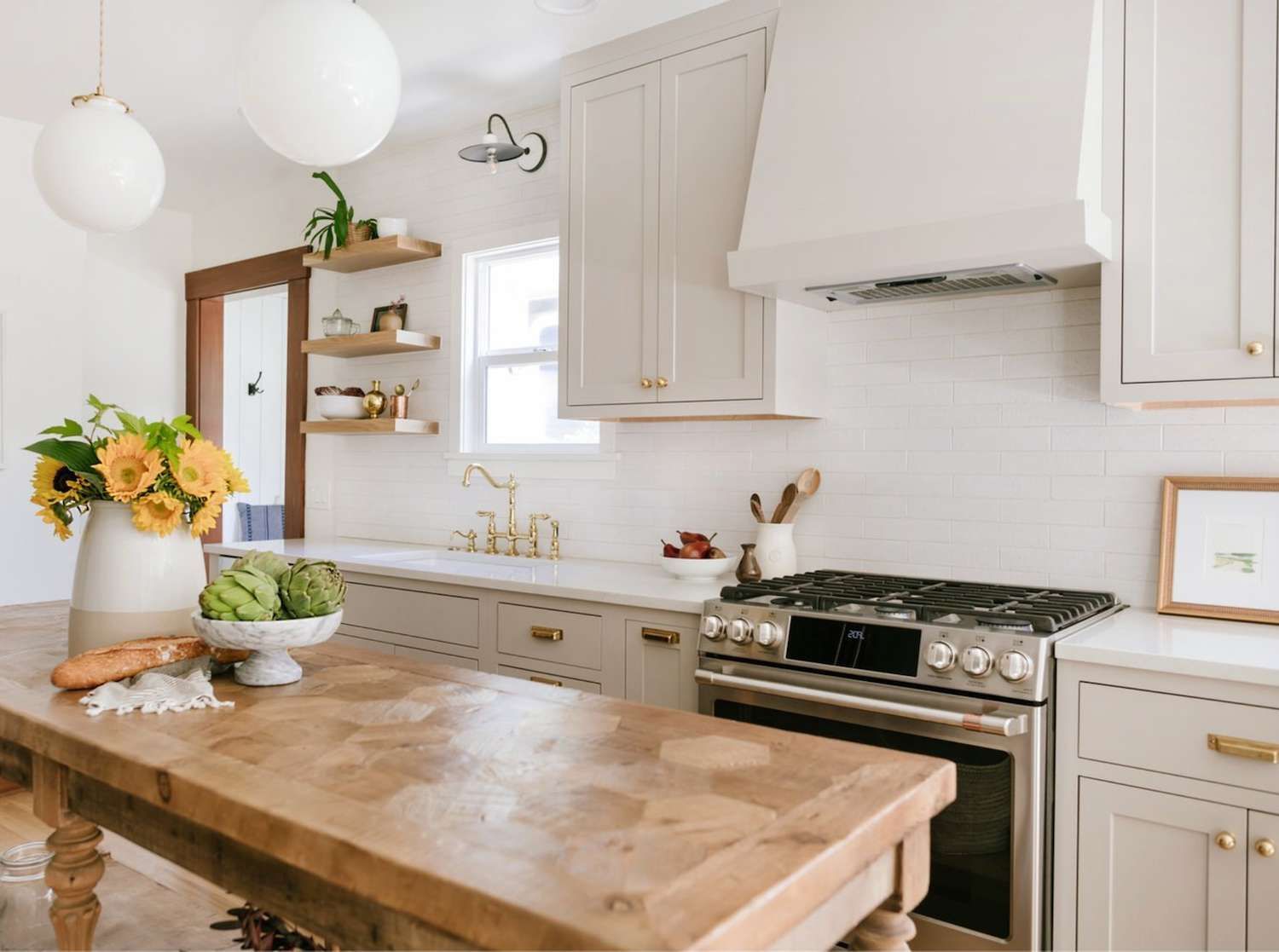 house cut out with a heart against a wood background