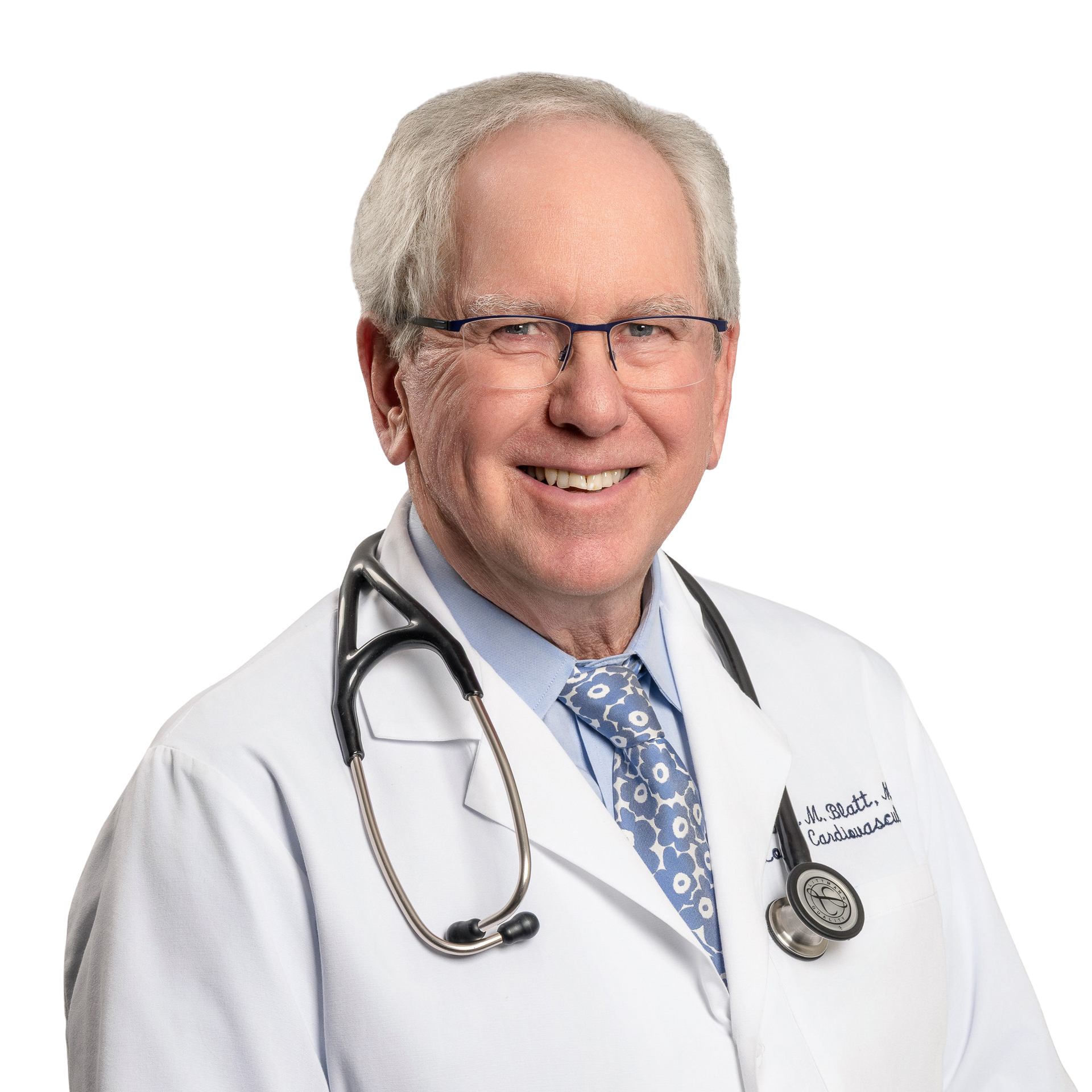 Smiling older doctor with glasses, stethoscope, white coat.