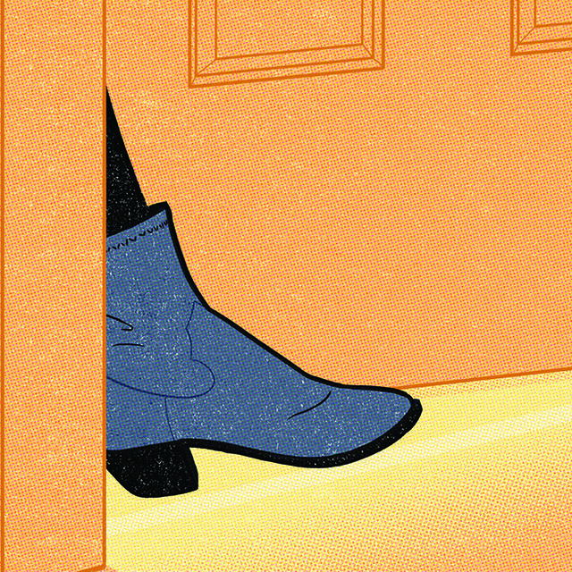 A blue boot is sticking out of a doorway