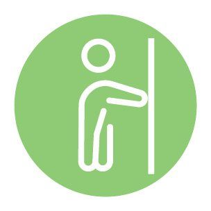 A person is leaning against a wall in a green circle.