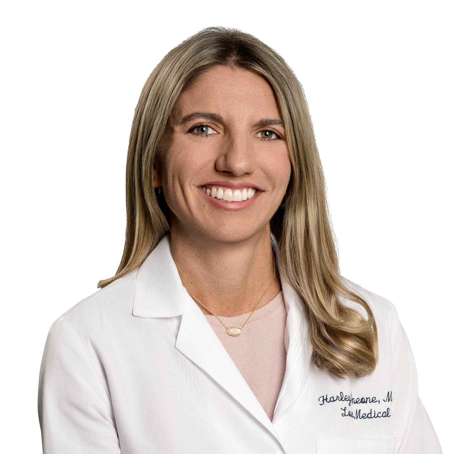 Smiling older doctor with glasses, stethoscope, white coat.