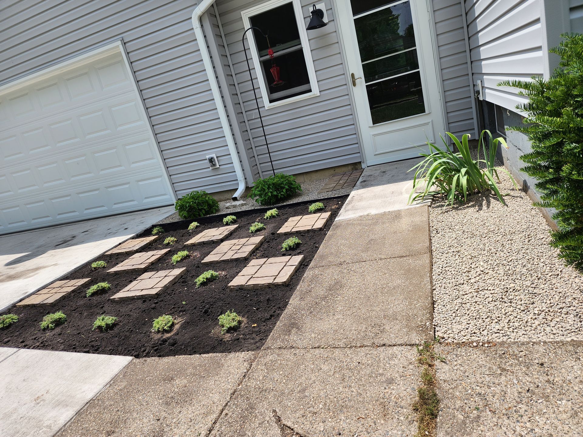 A walkway leading to the front door of a house