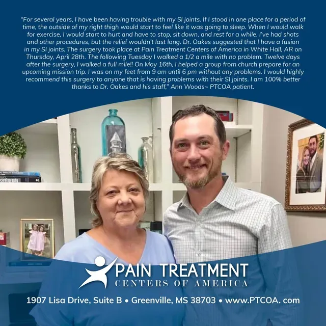 A man and woman are posing for a photo at pain treatment centers of america