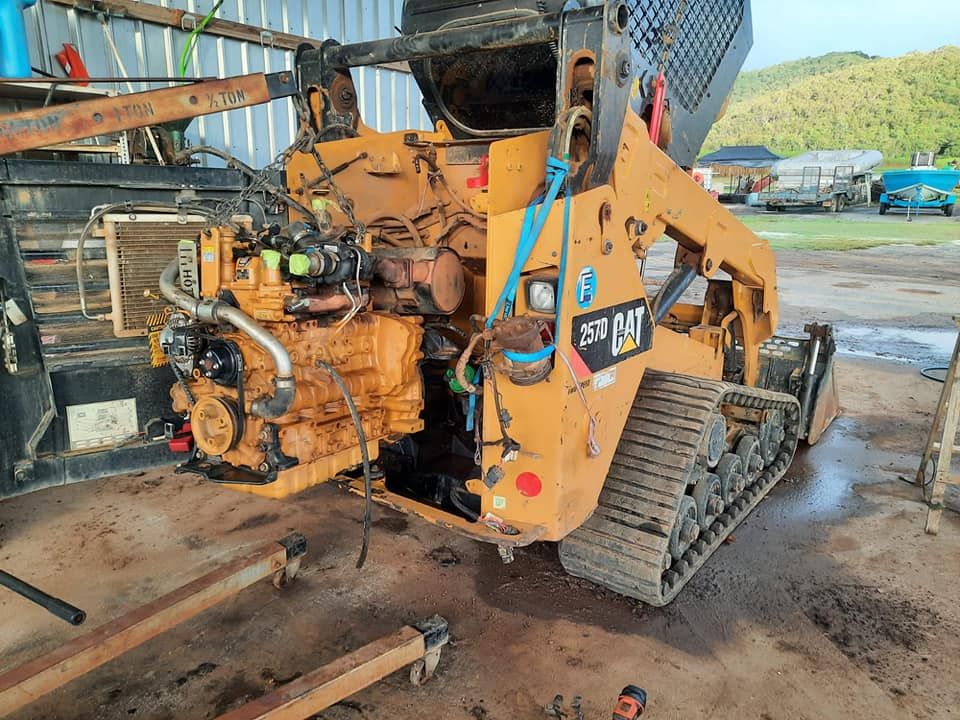 A Bulldozer With the Engine Removed is Sitting on the Ground — Giger Machinery Services in Gordonvale, QLD