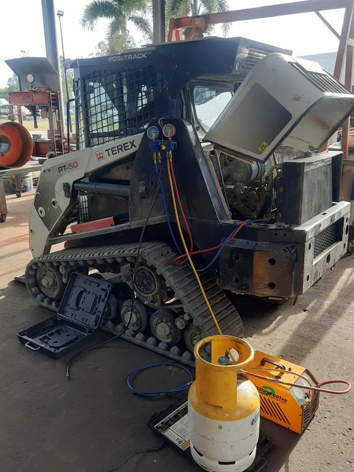 A Bulldozer is Being Serviced in a Garage — Giger Machinery Services in Atherton, QLD