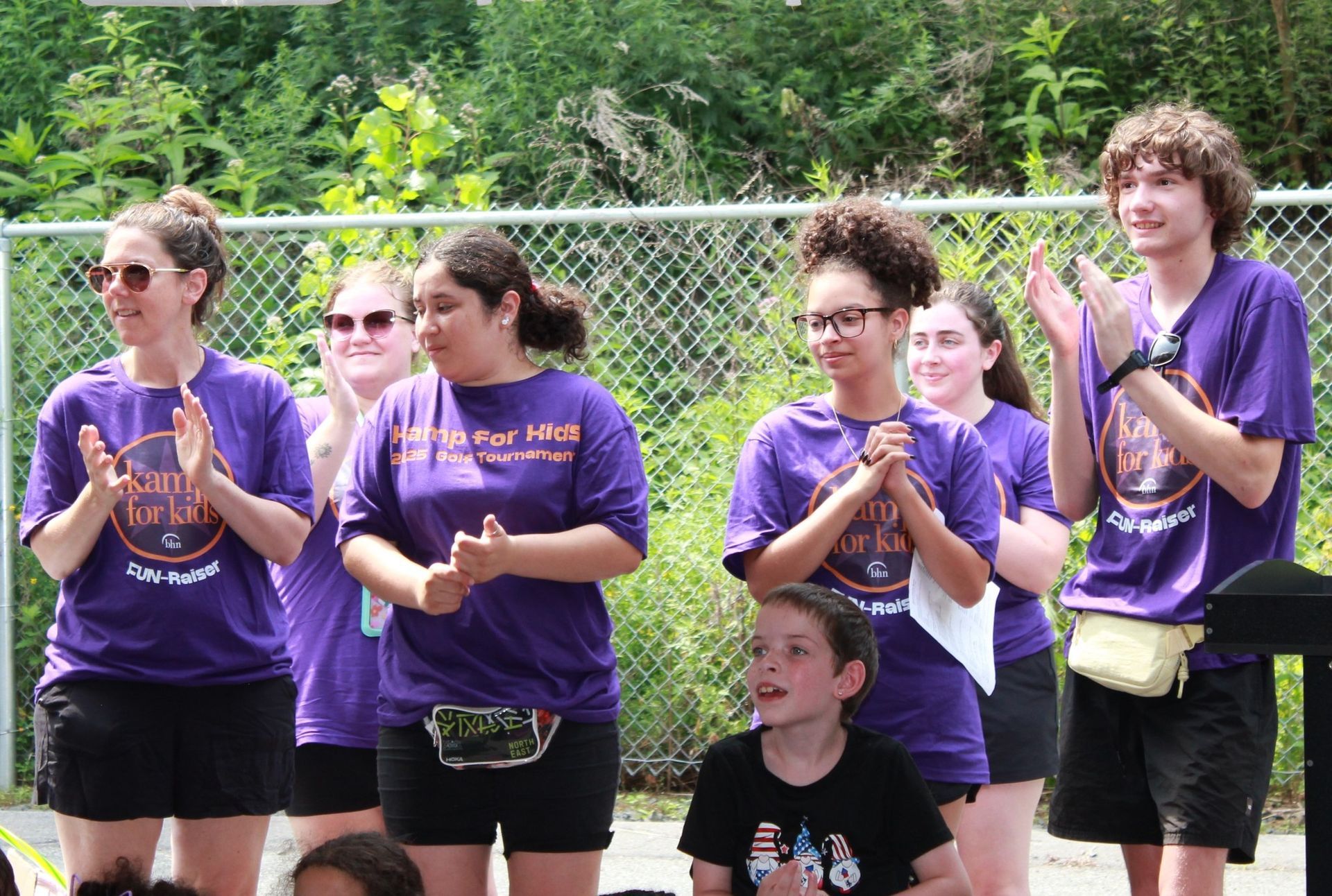 Kamp counselors cheering on their campers.