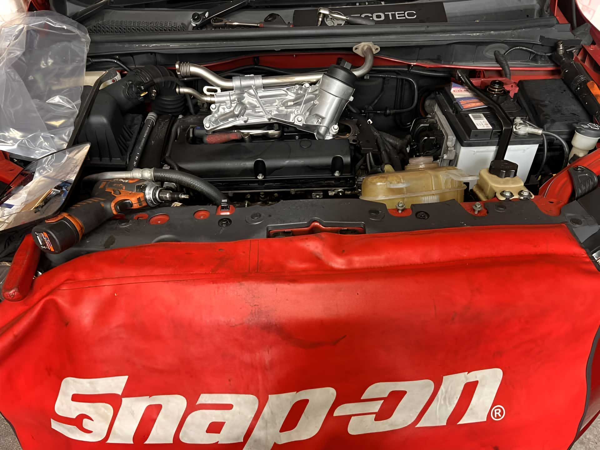 The Engine of a Car is Covered in a Snap on Bag — Canberra AutoCare In Fisher, ACT