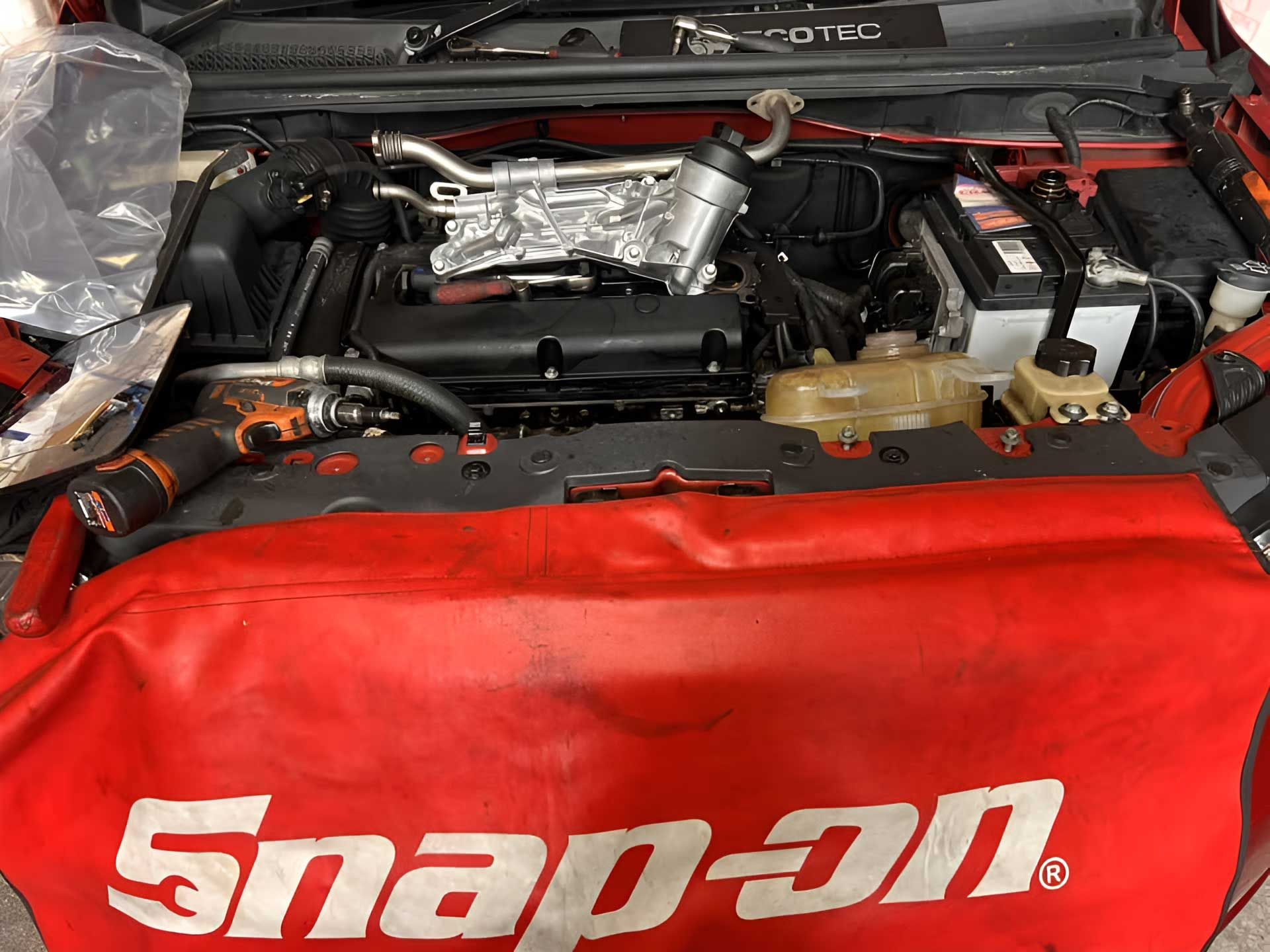 The Engine Of A Car Is Covered With A Snap On Tool Bag — Canberra AutoCare In Fisher, ACT