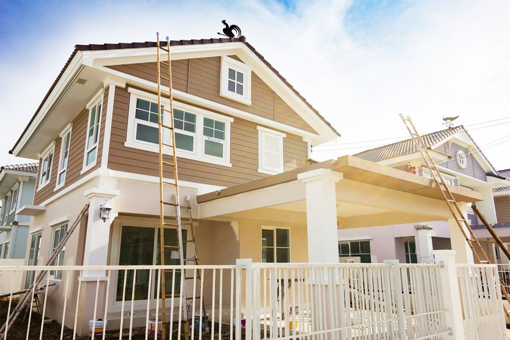 Ladders placed on the house for exterior house painting — Interior Painting in Hervey Bay, QLD