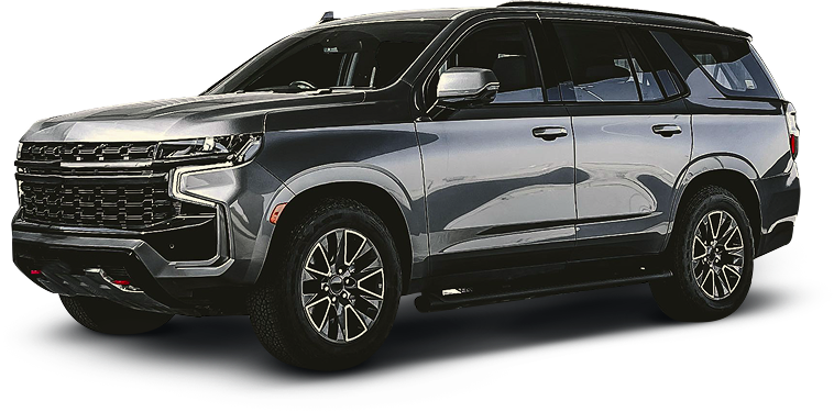 A charcoal gray Chevrolet Tahoe SUV viewed from the front three-quarter angle against a white background. | J's Automotive