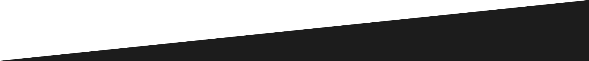 A charcoal gray Chevrolet Tahoe SUV viewed from the front three-quarter angle against a white background. | J's Automotive