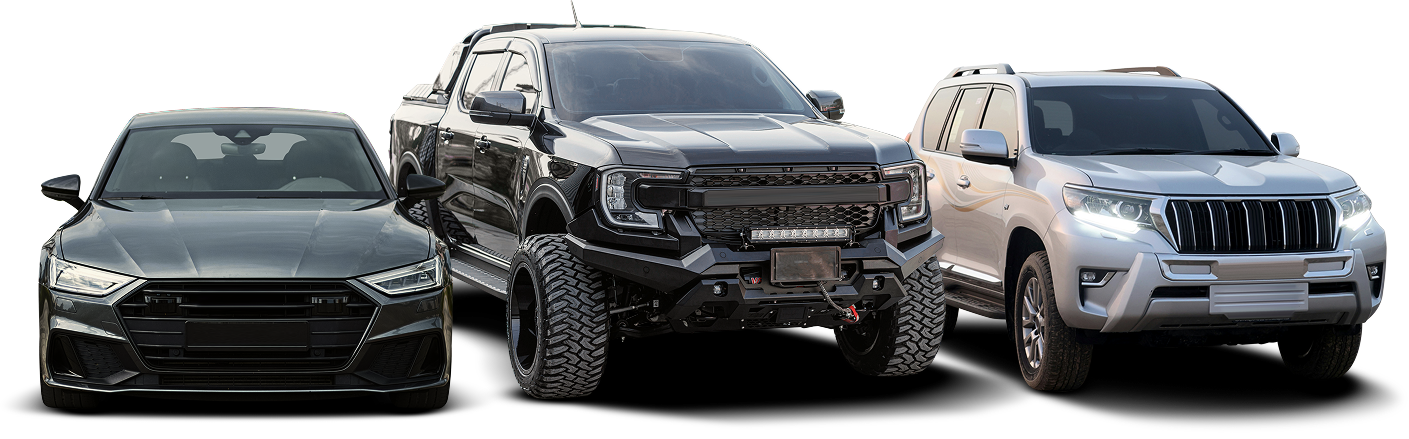 Three vehicles parked side-by-side: a grey sedan, a modified black pickup truck, and a white SUV. | J's Automotive