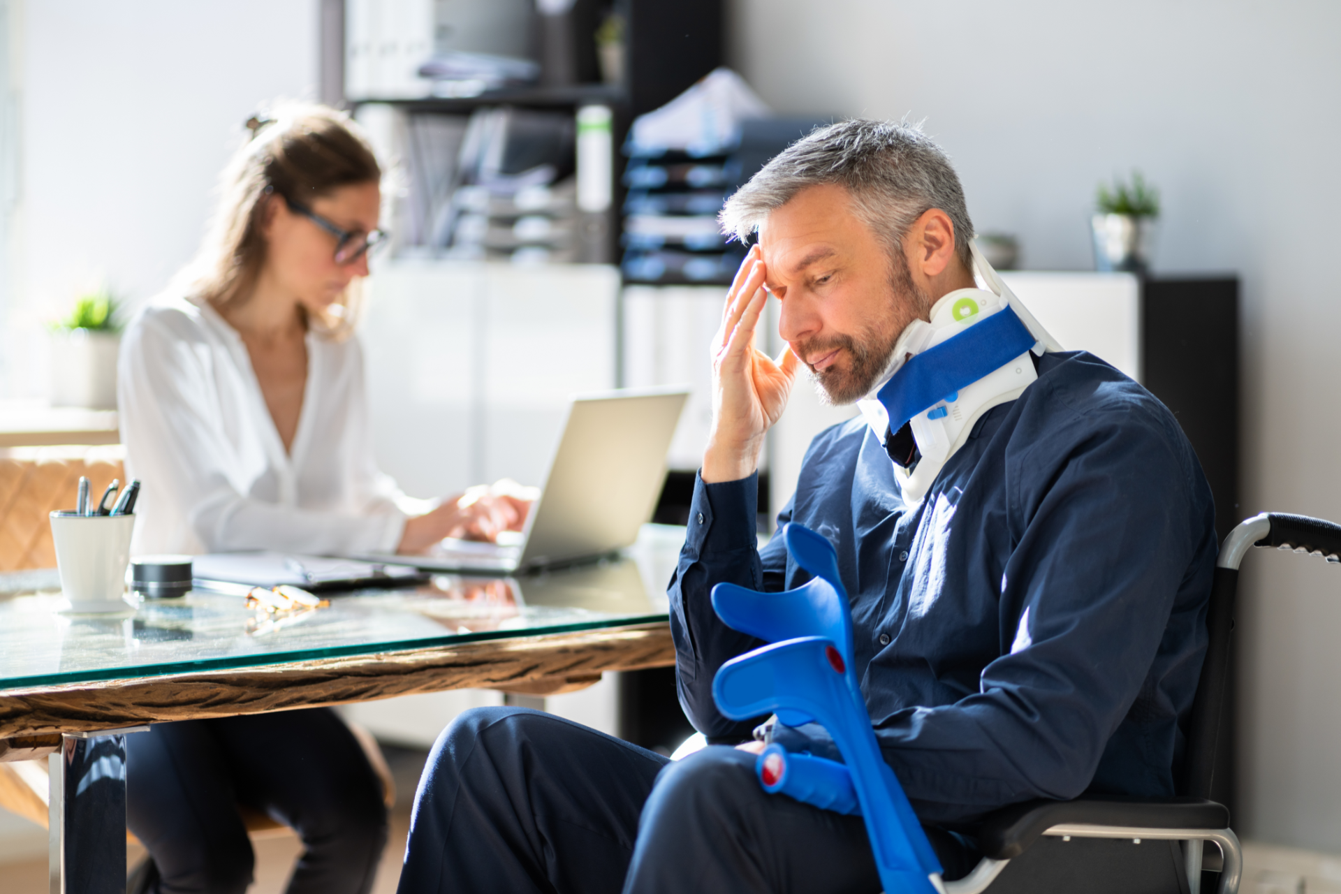 Family outdoors: older adult holding a baby, woman holding a young child, all smiling. Cloudy sky.