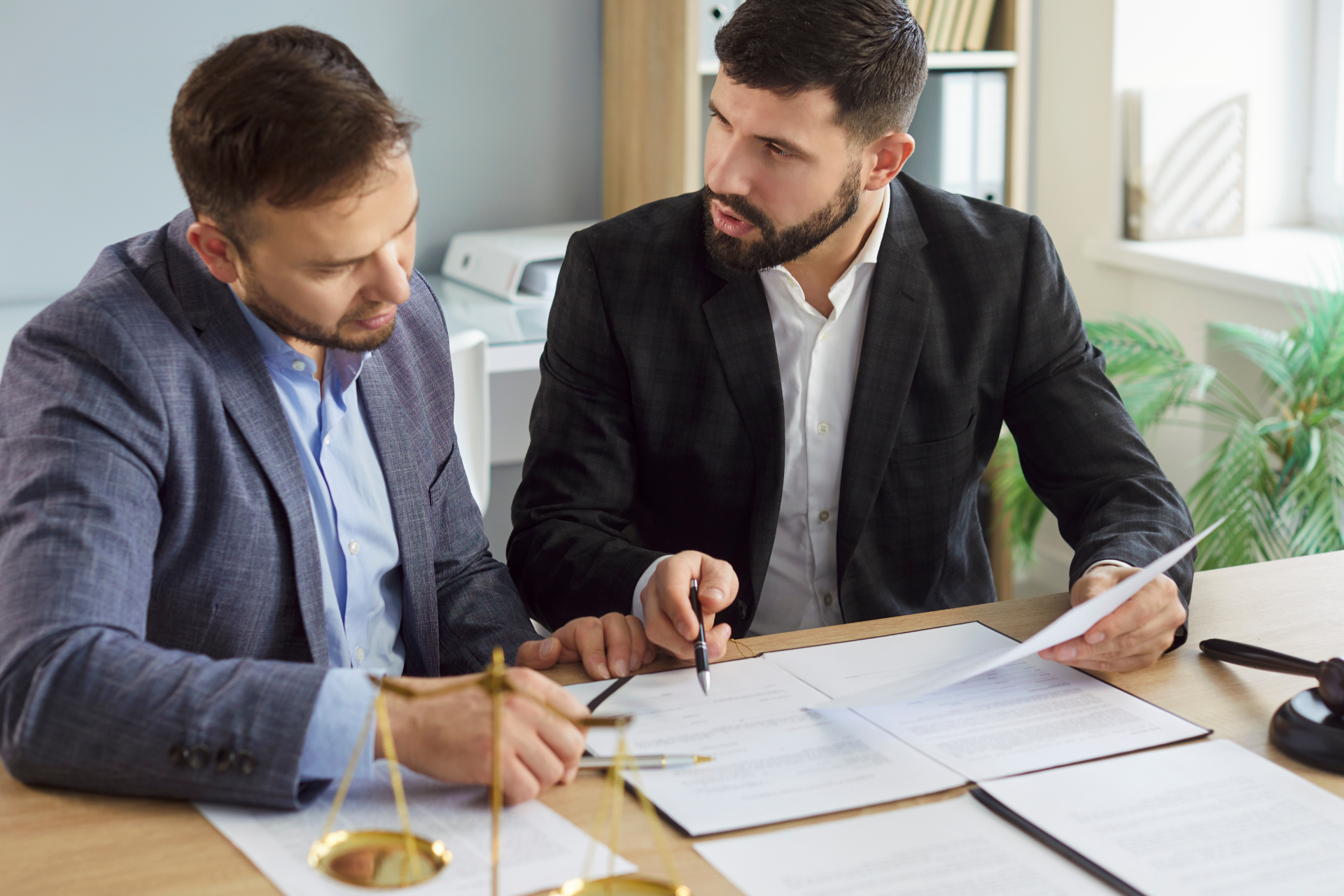 Palm trees frame tall city skyscrapers against a bright, sunny sky.