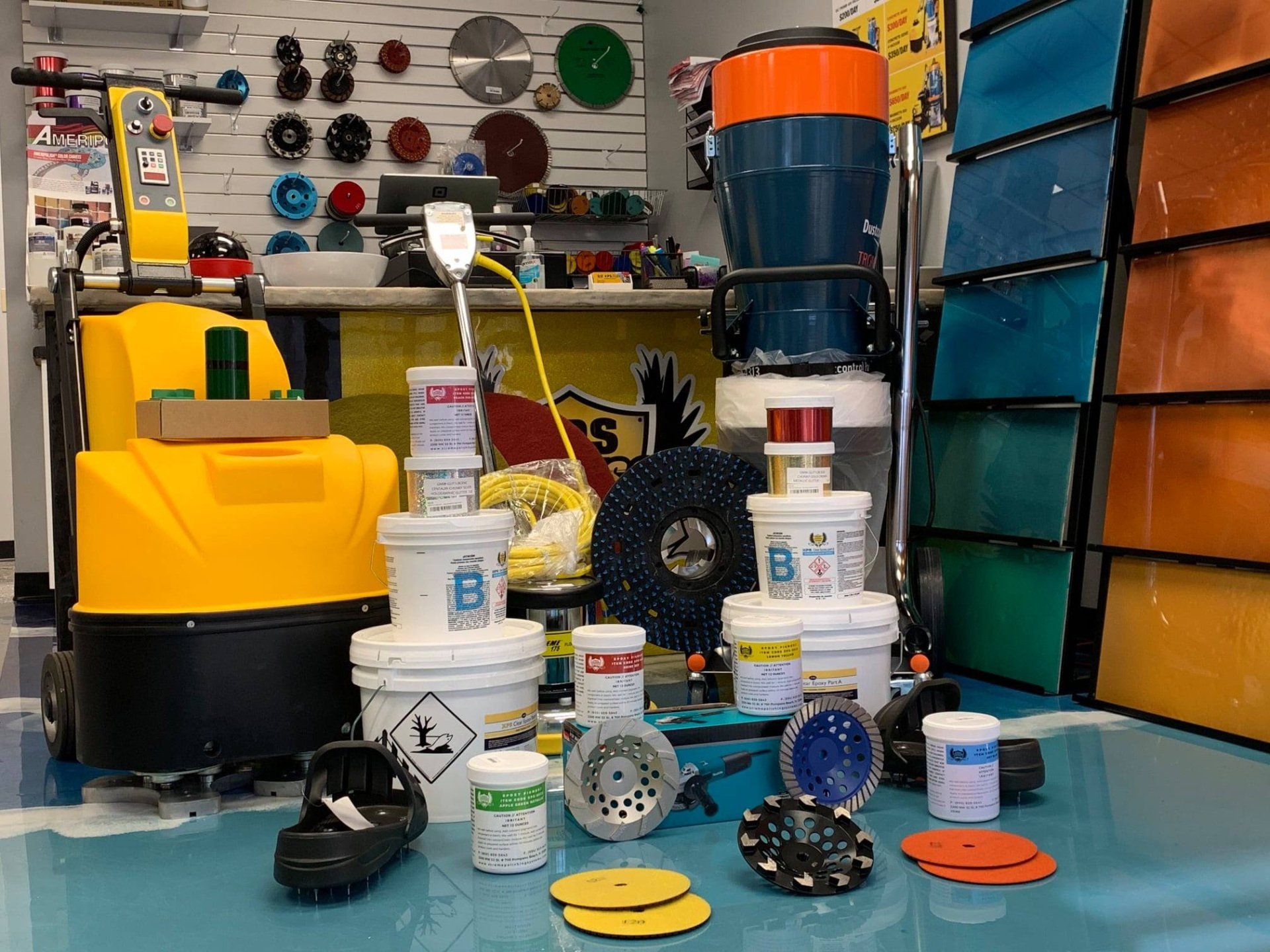 A showroom with floor polishing equipment, tools, and supplies on display.