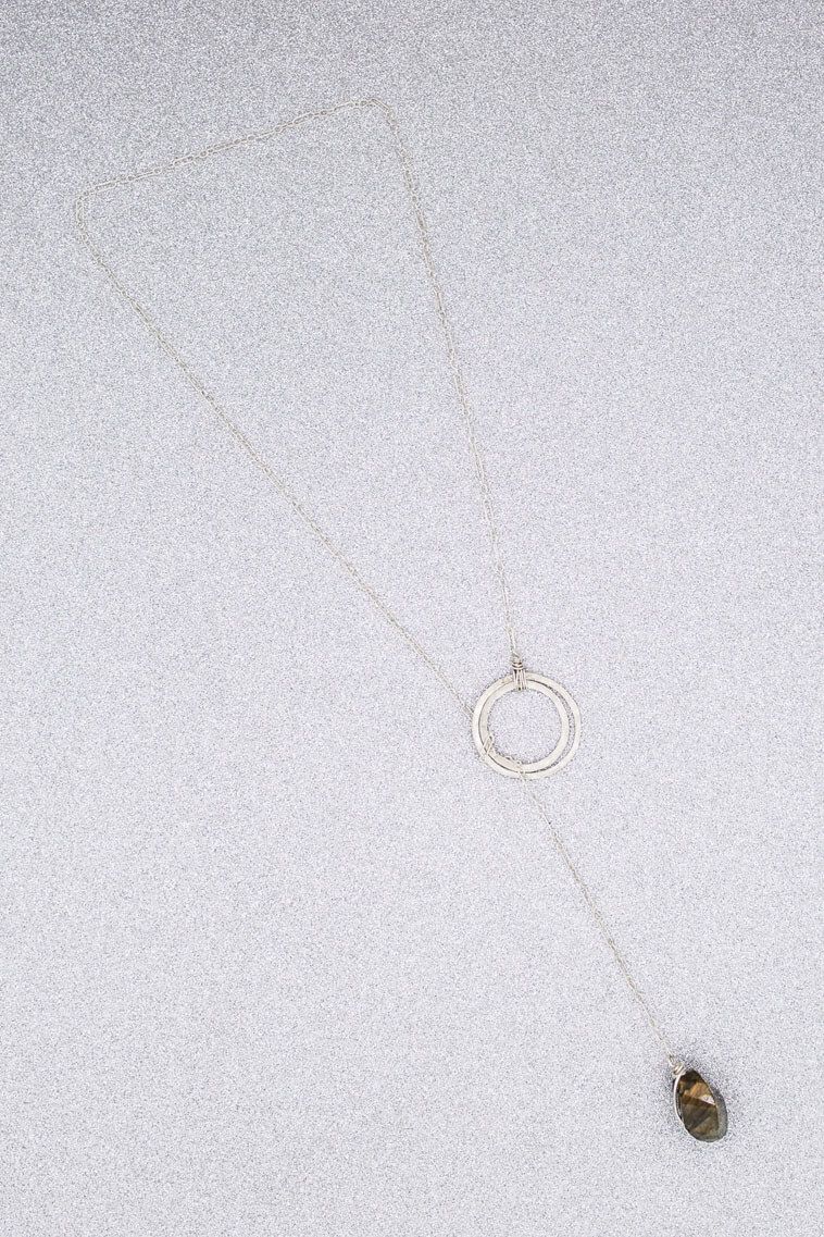 A close up of a bug on a white surface.