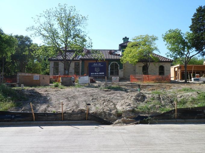 A house that is being built with a blue tarp on it