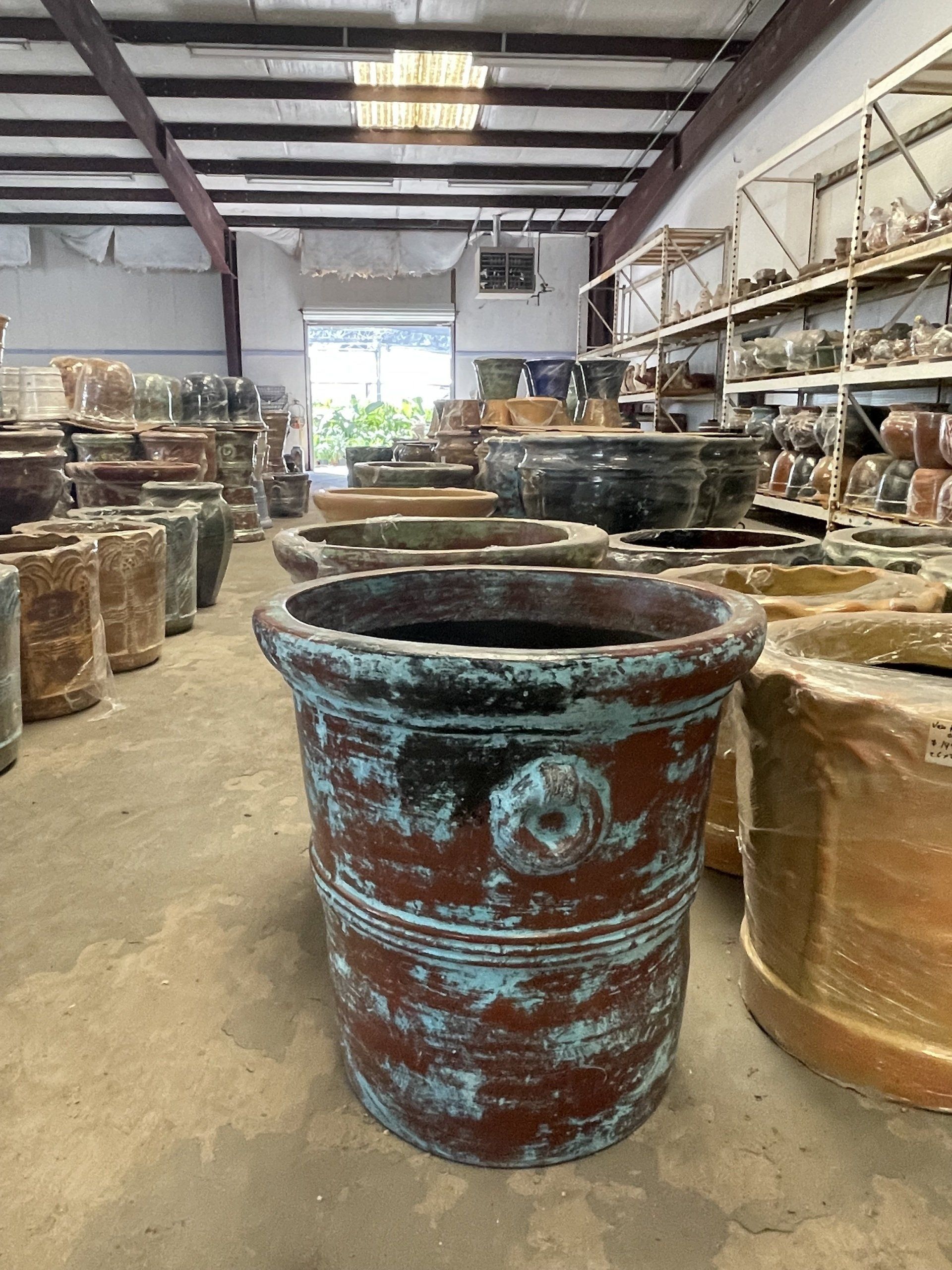 A warehouse filled with lots of pots and vases.