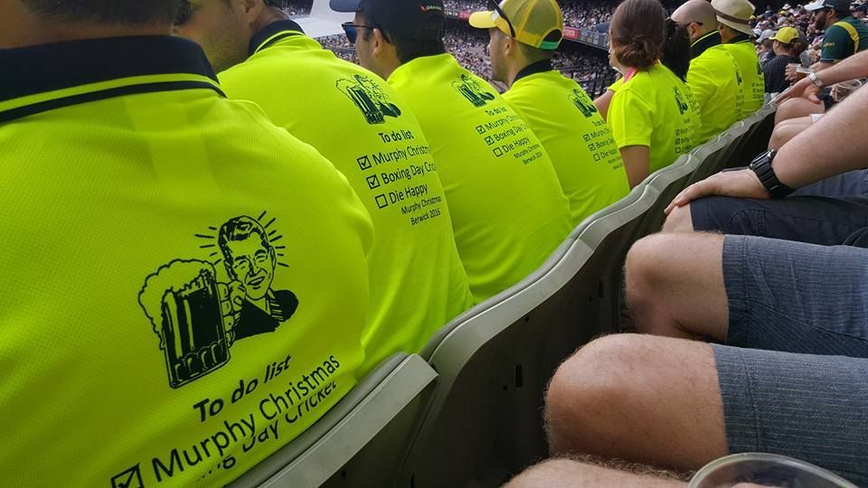 A Man Holding Up A Jersey — Sportstar Screenprinting In Newtown, QLD