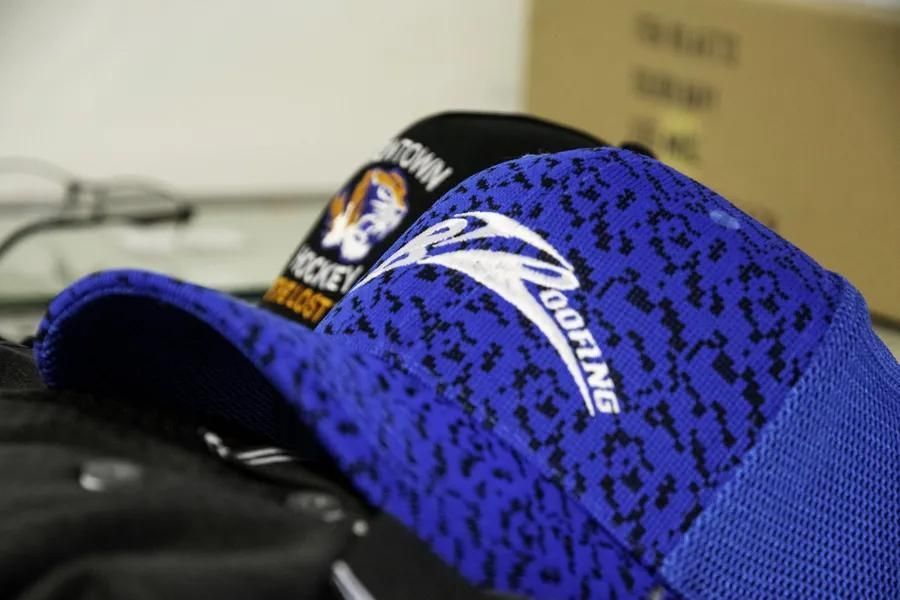 A Close Up Of A Blue Hat That Says Roofing On It — Sportstar Screenprinting in Dalby, QLD