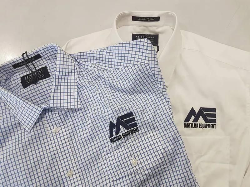 Two Polo Shirts With The Word Matilda Equipment Embroidered On Them — Sportstar Screenprinting In Newtown, QLD
