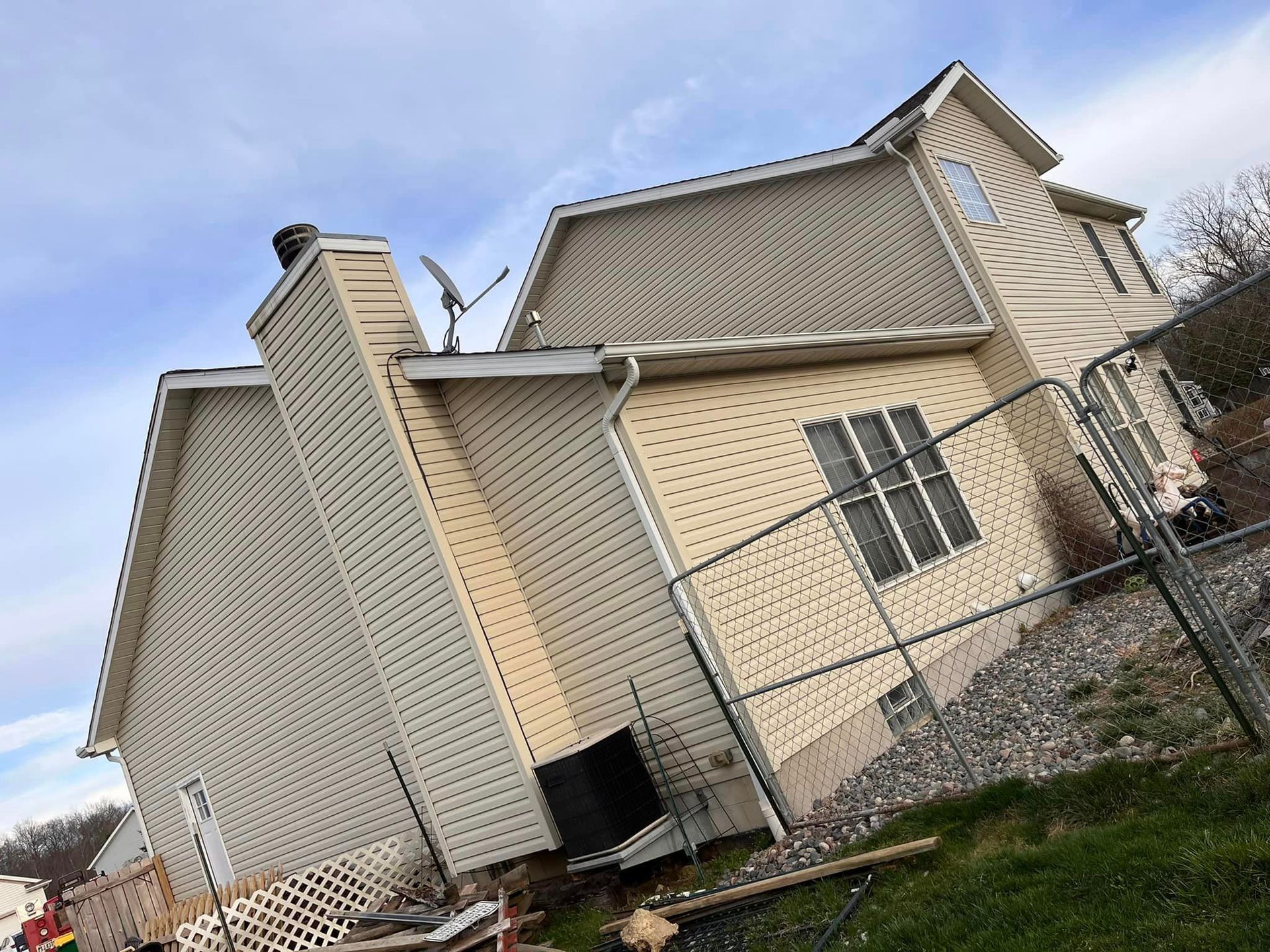 A house with a chimney on the side of it
