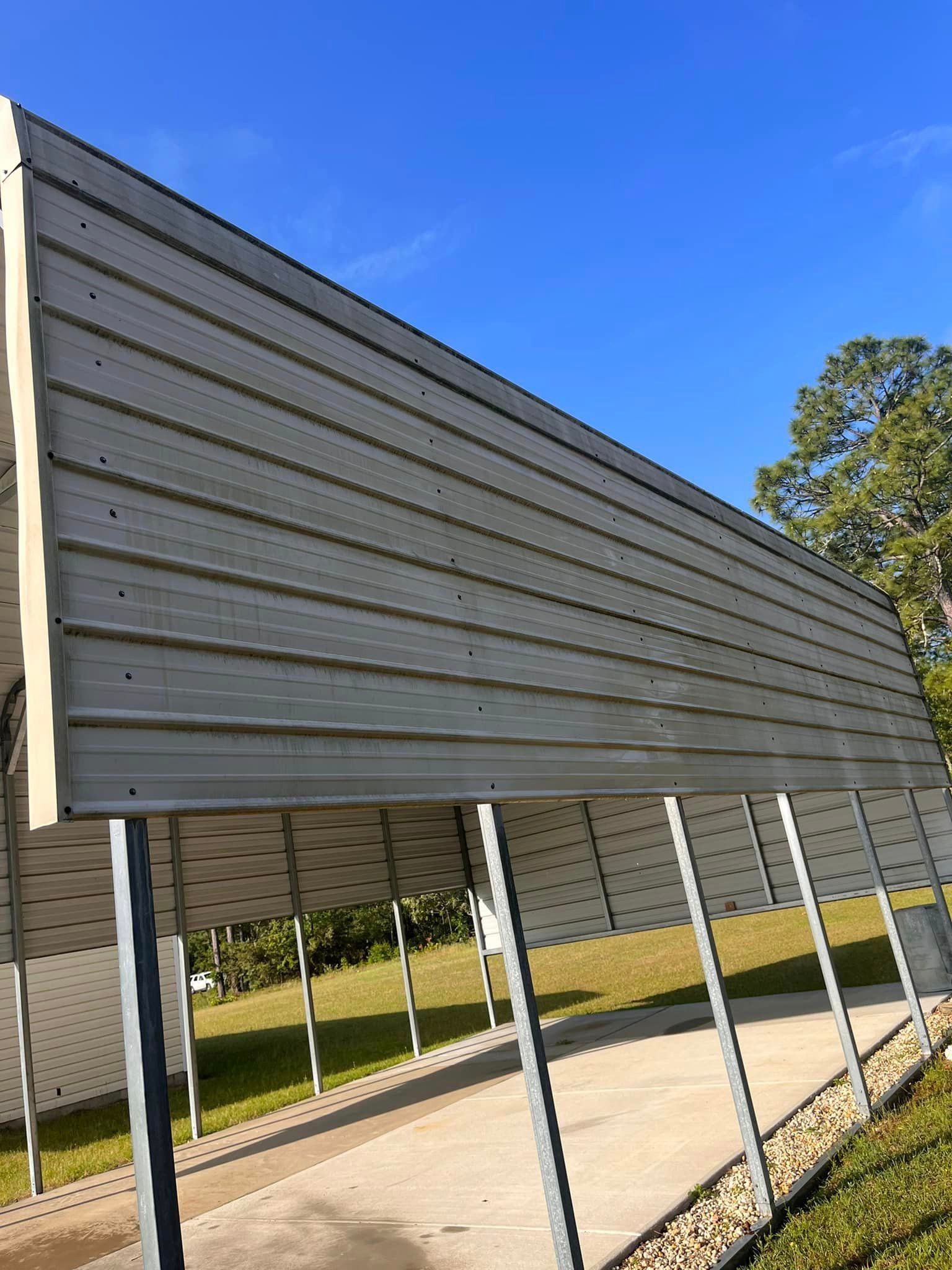 A carport with a blue sky in the background