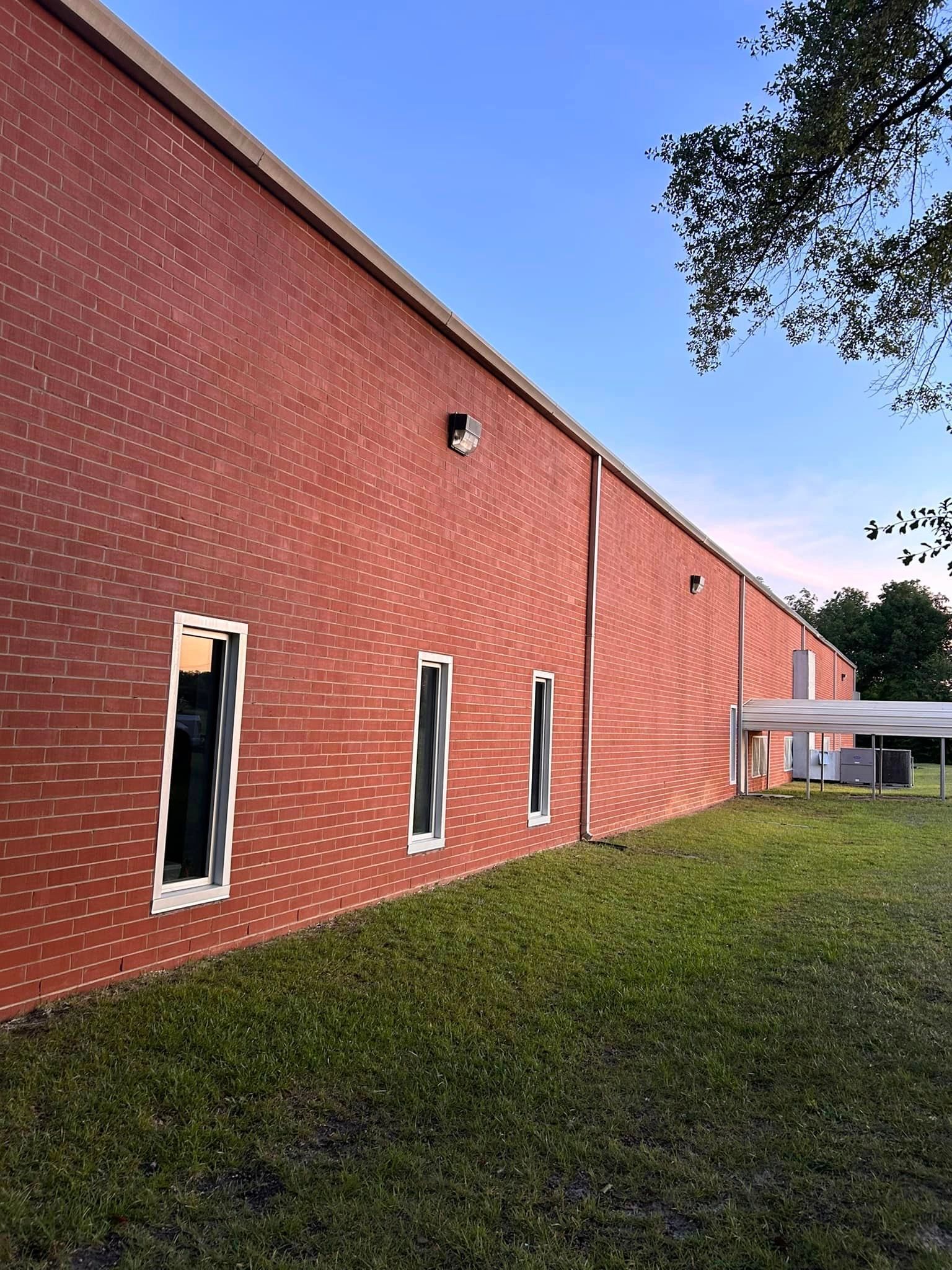 A large red brick building with a lot of windows