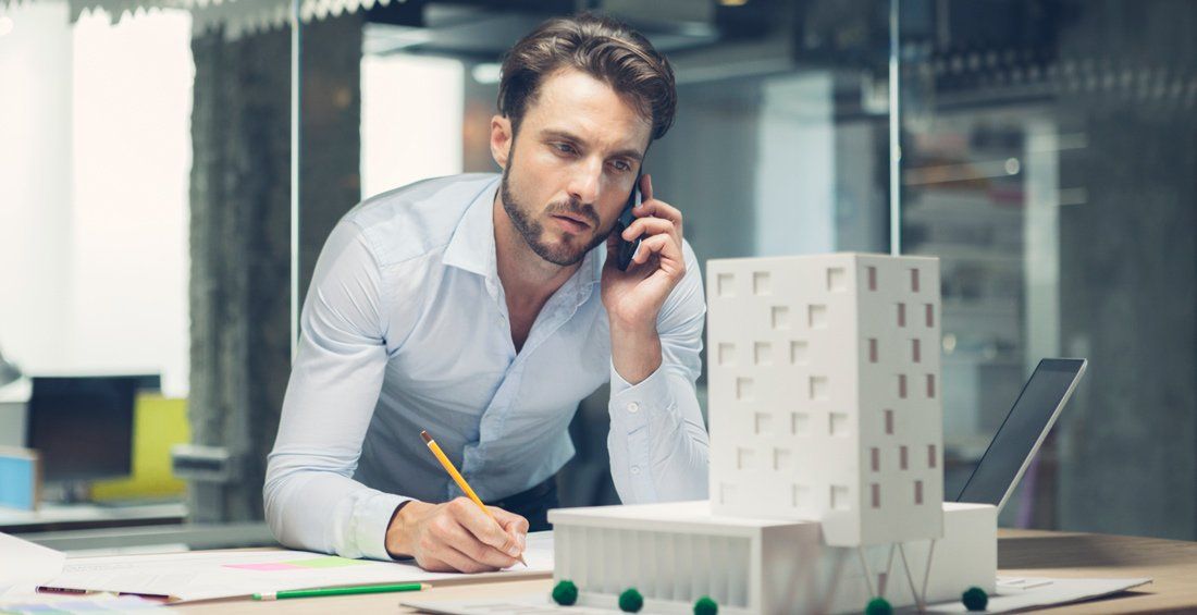 architect looking at small scale building