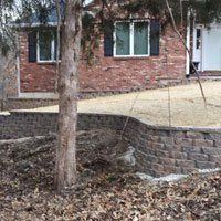 Stop Erosion & Create a Lovely Landscaping Feature with a Retaining Wall by Quality Cut Lawn Care