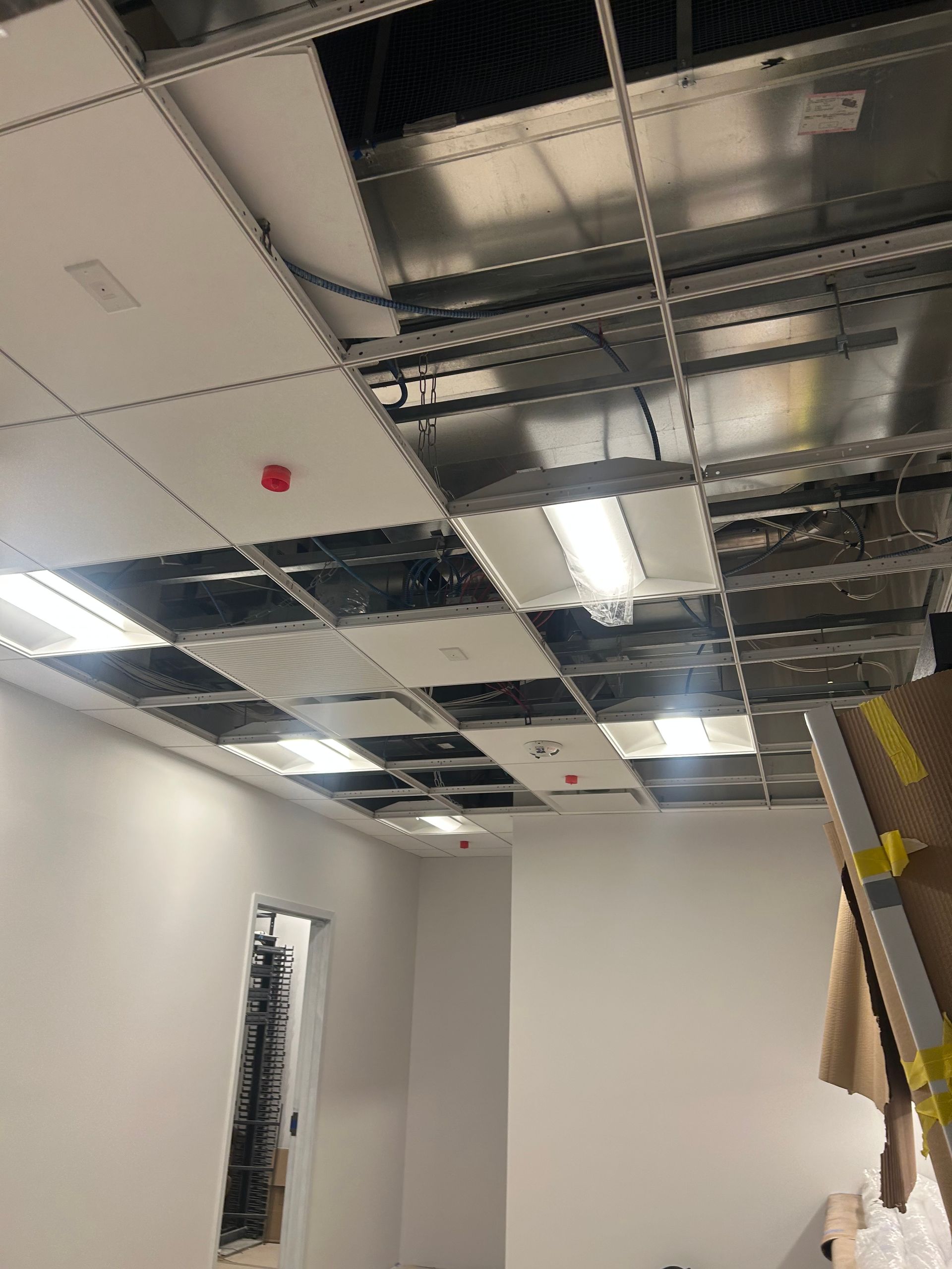 A room with a ceiling that is being remodeled.