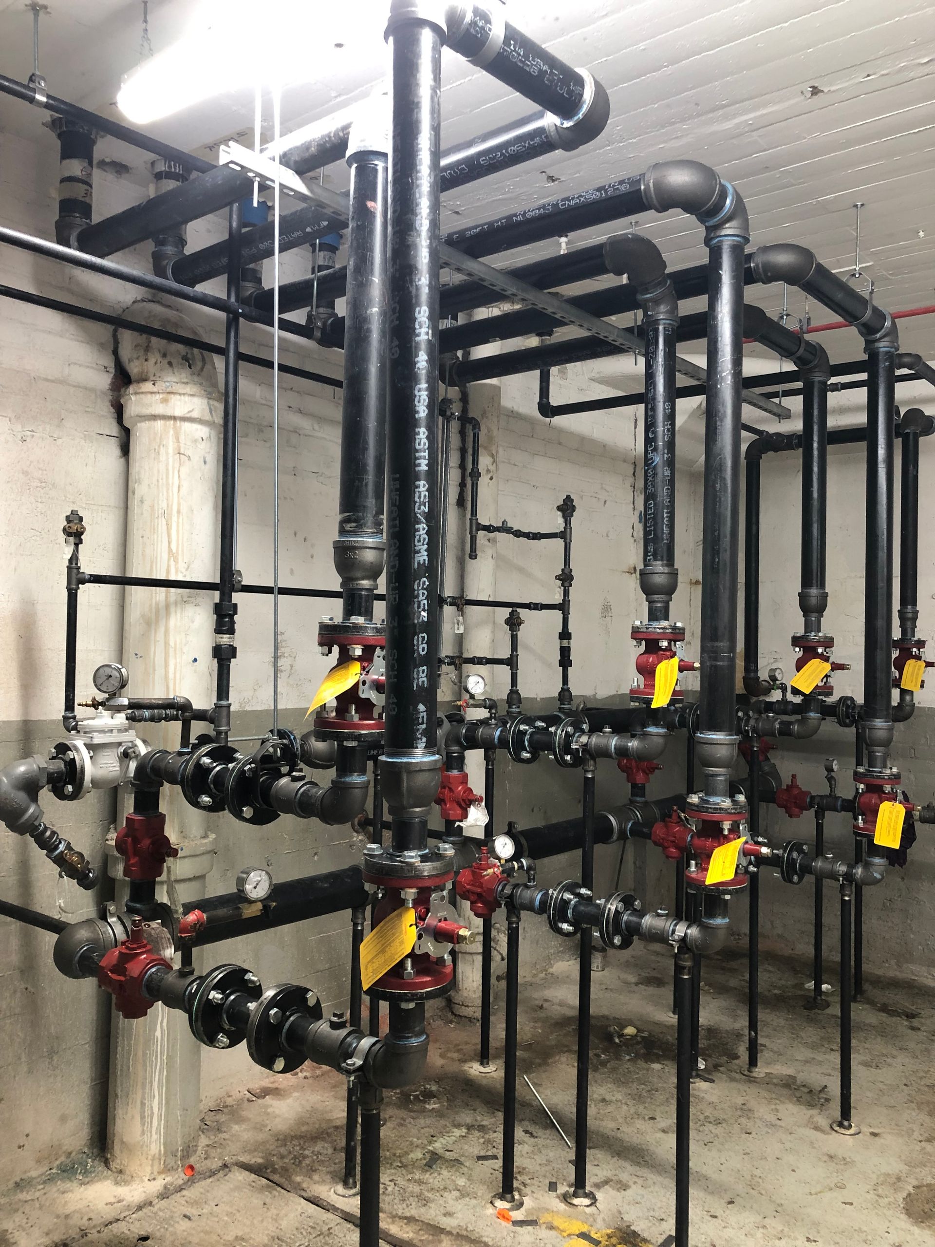 A room filled with lots of pipes and valves