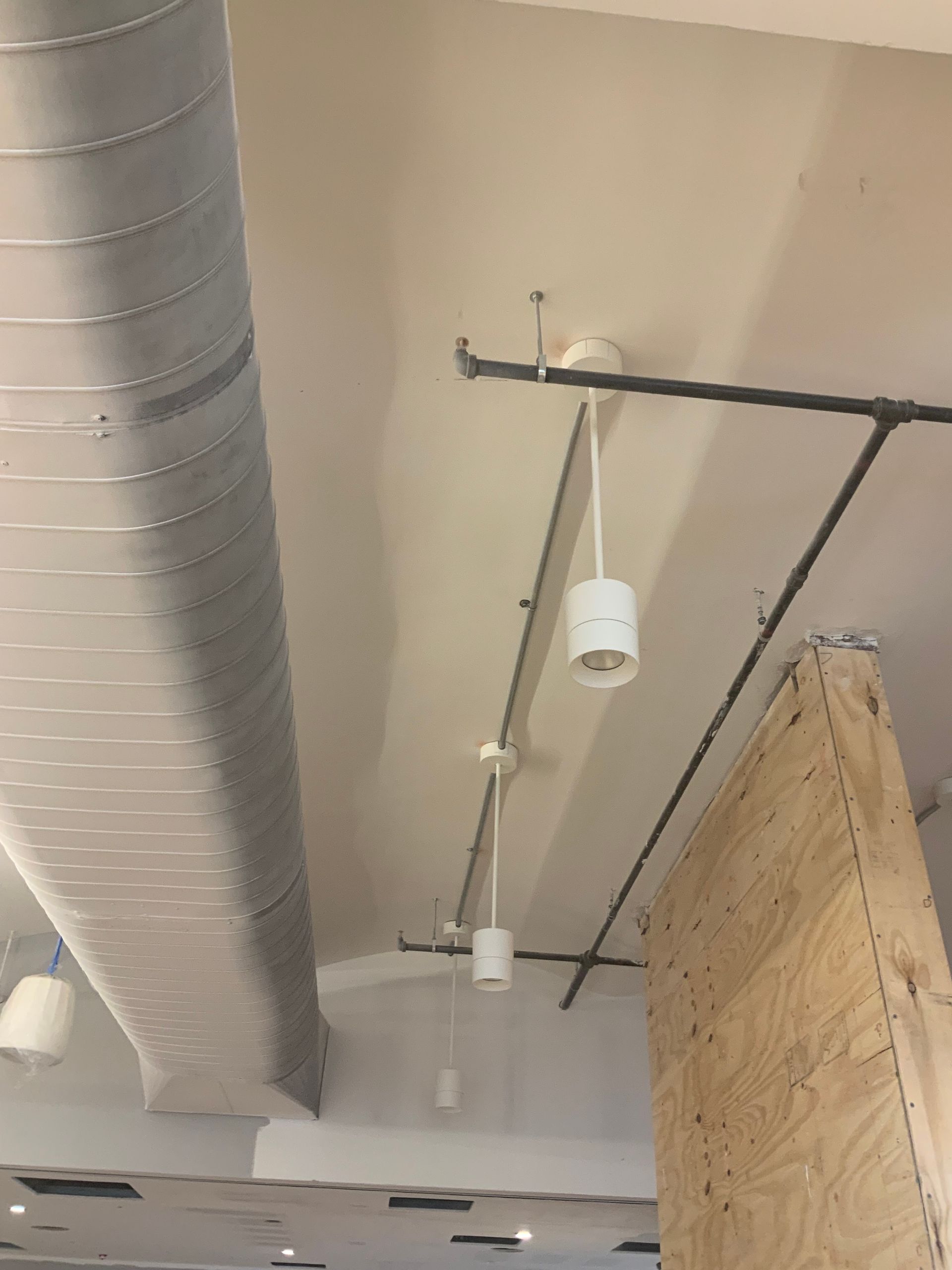 A ceiling with a few lights hanging from it