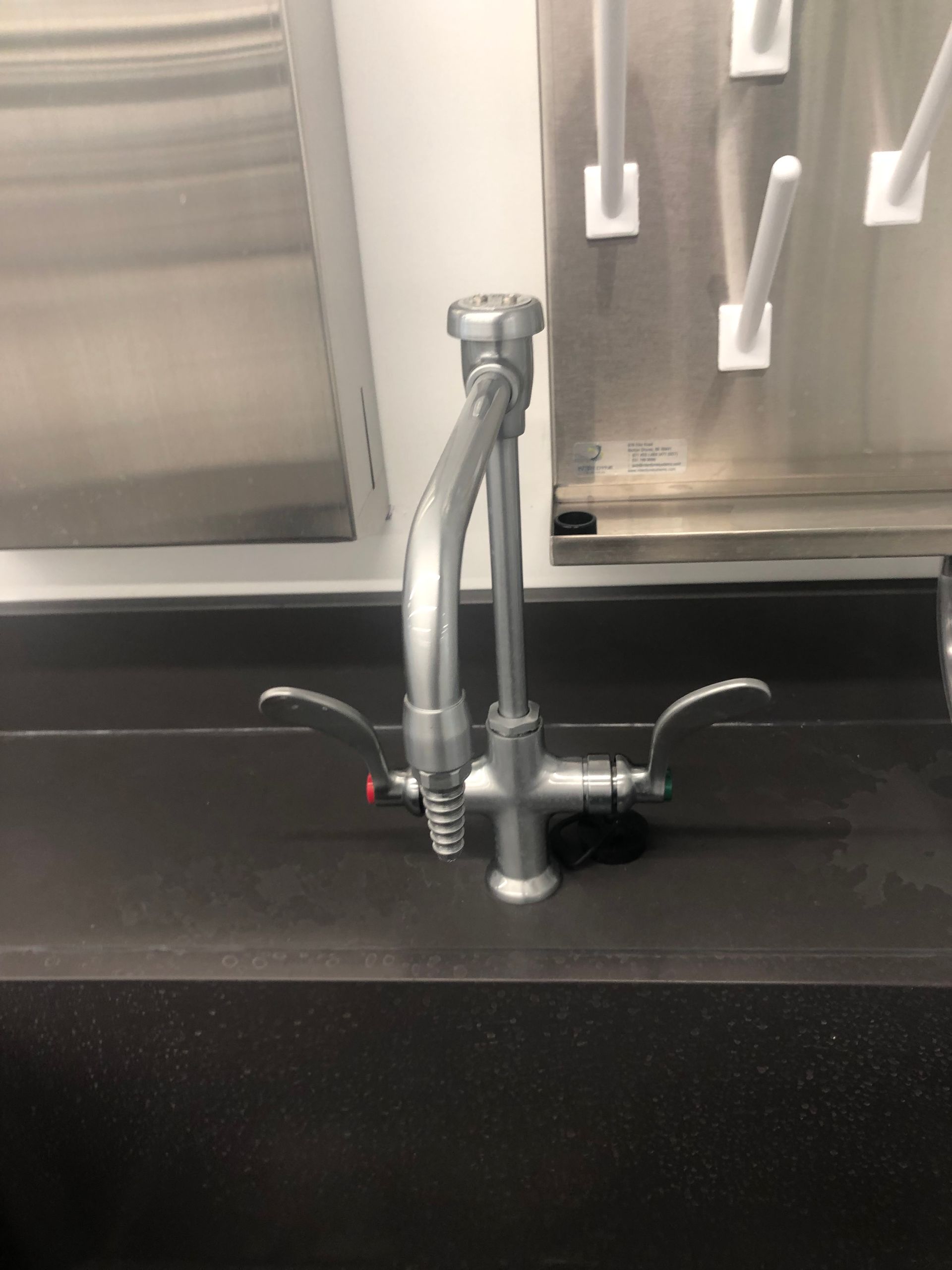 A close up of a faucet on a kitchen counter