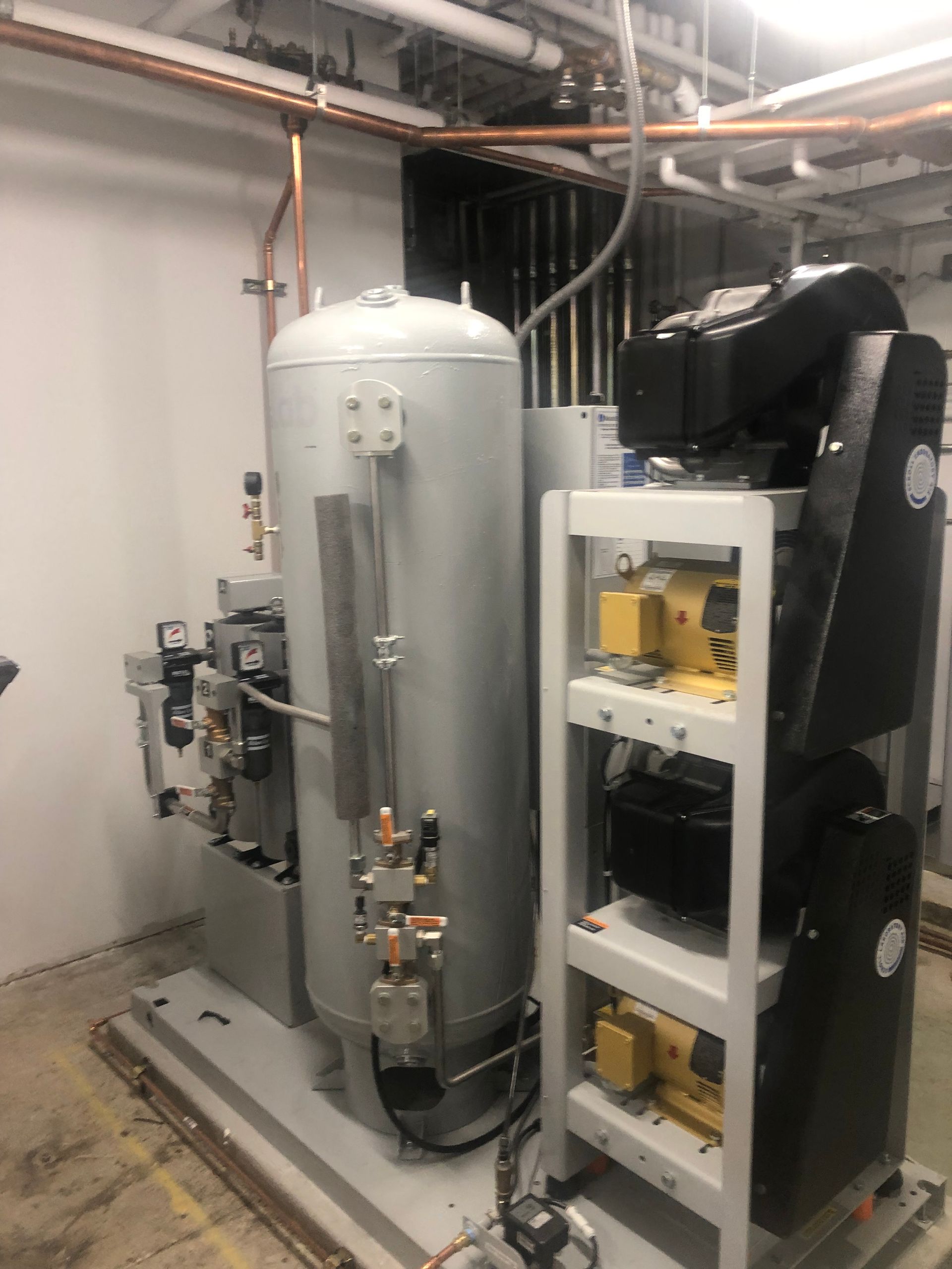 A room with a lot of machinery and pipes in it