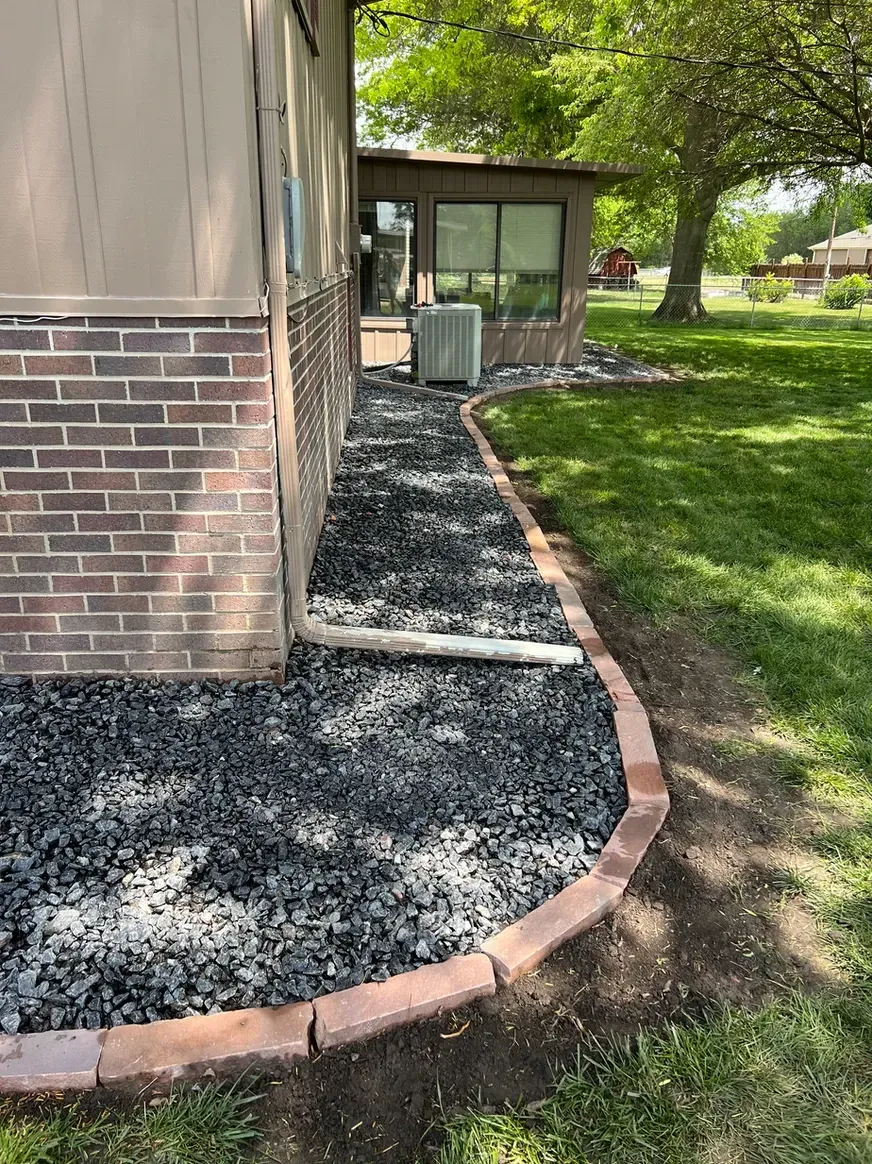 Sidewalk Is Being Built in Front of A Brick House — Exeter, NE — Axline Landscaping & Trees