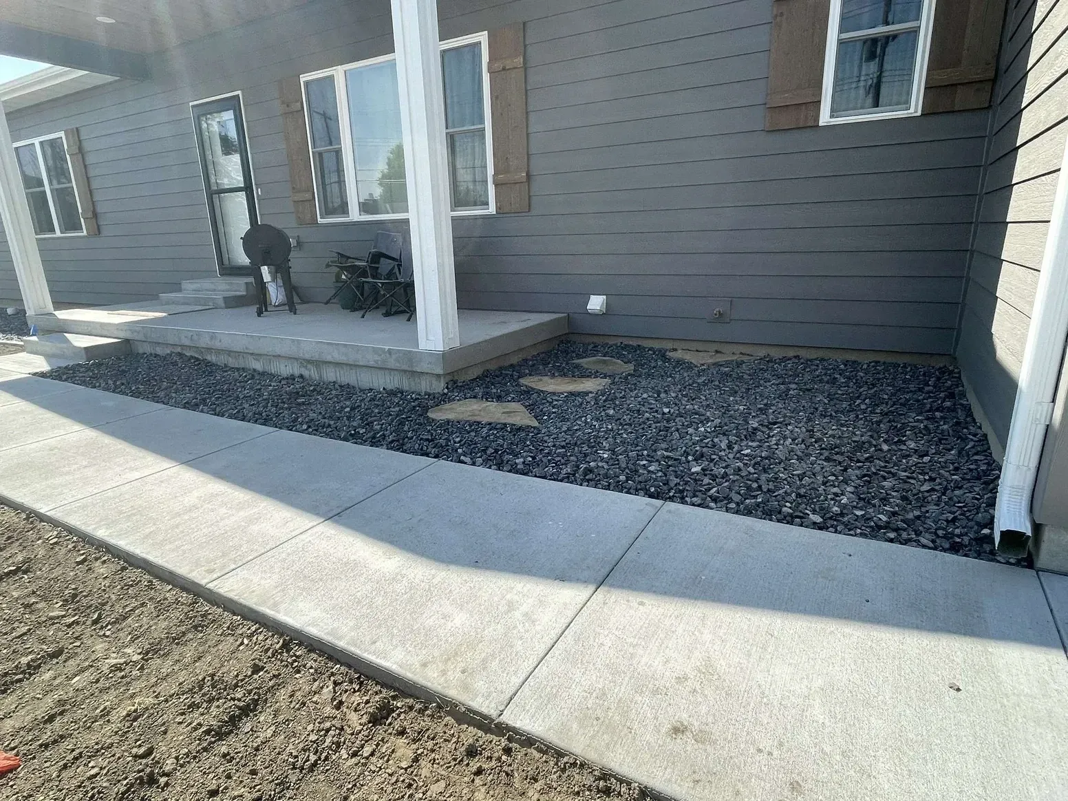 A House with A Porch and A Sidewalk — Exeter, NE — Axline Landscaping & Trees
